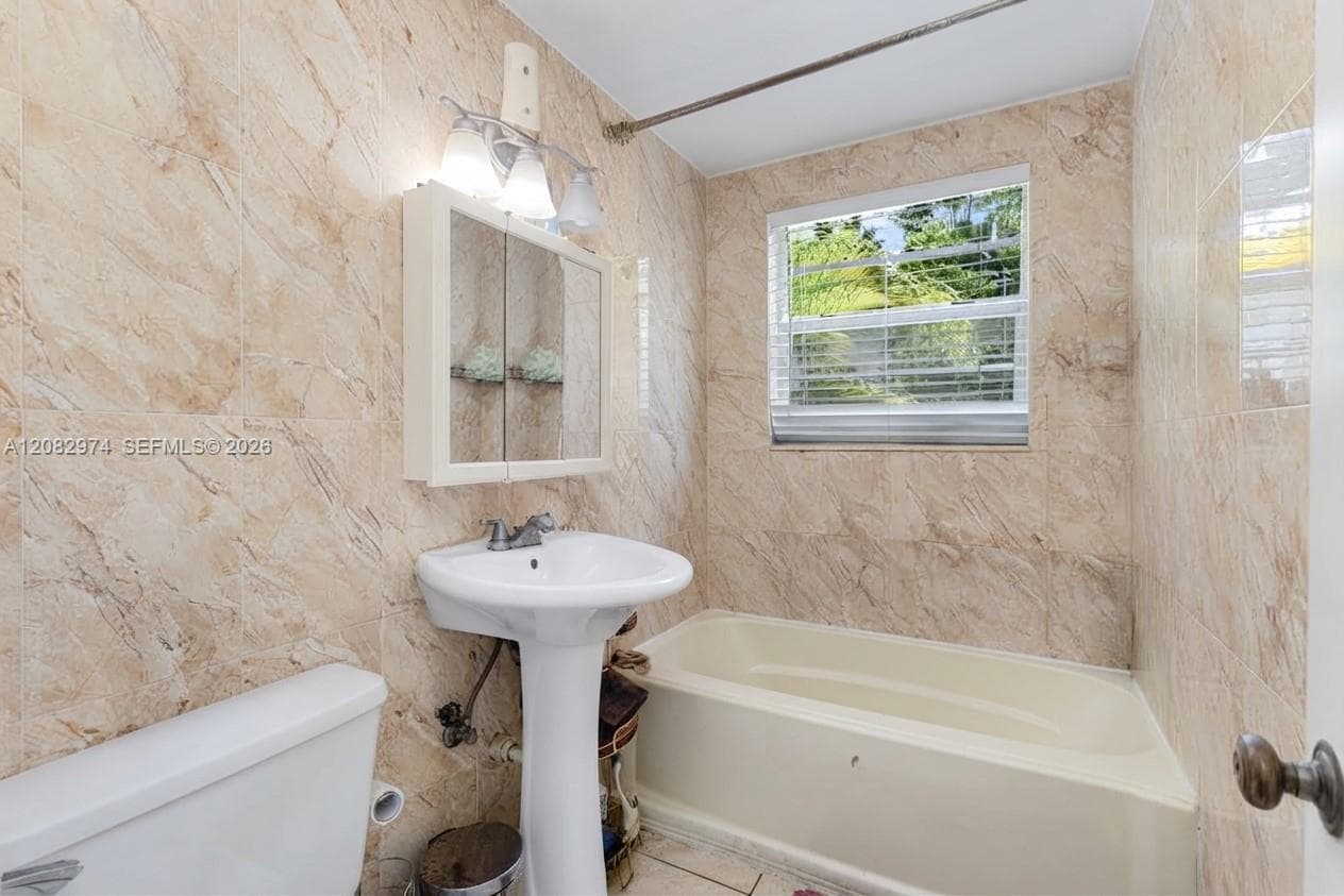 AI-modified image. Shower curtain digitally removed