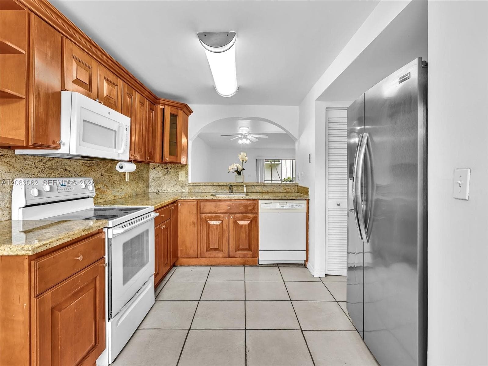 Ample Kitchen, Granite Counters, and huge window brings in natural light.