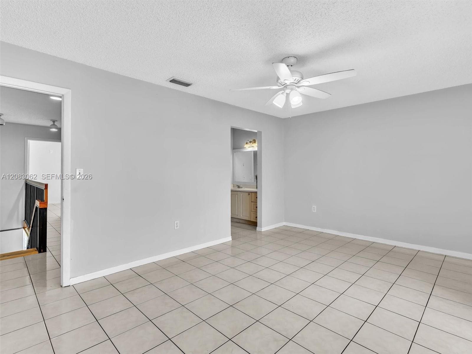 Primary Bedroom with full bathroom, balcony and walk in closet.