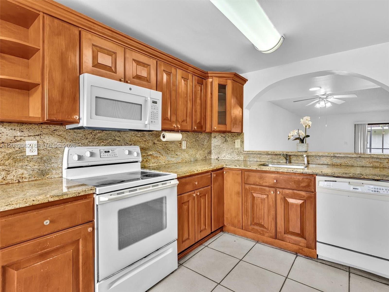 Ample Kitchen, Granite Counters, and huge window brings in natural light.