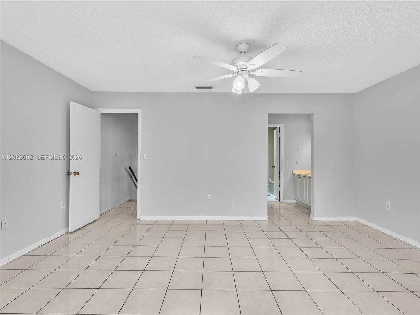 Primary Bedroom with full bathroom, balcony and walk in closet.