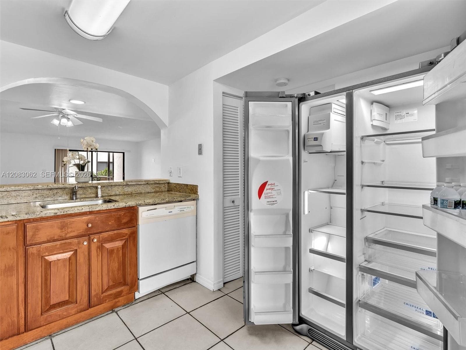 Ample Kitchen, Granite Counters, and huge window brings in natural light.