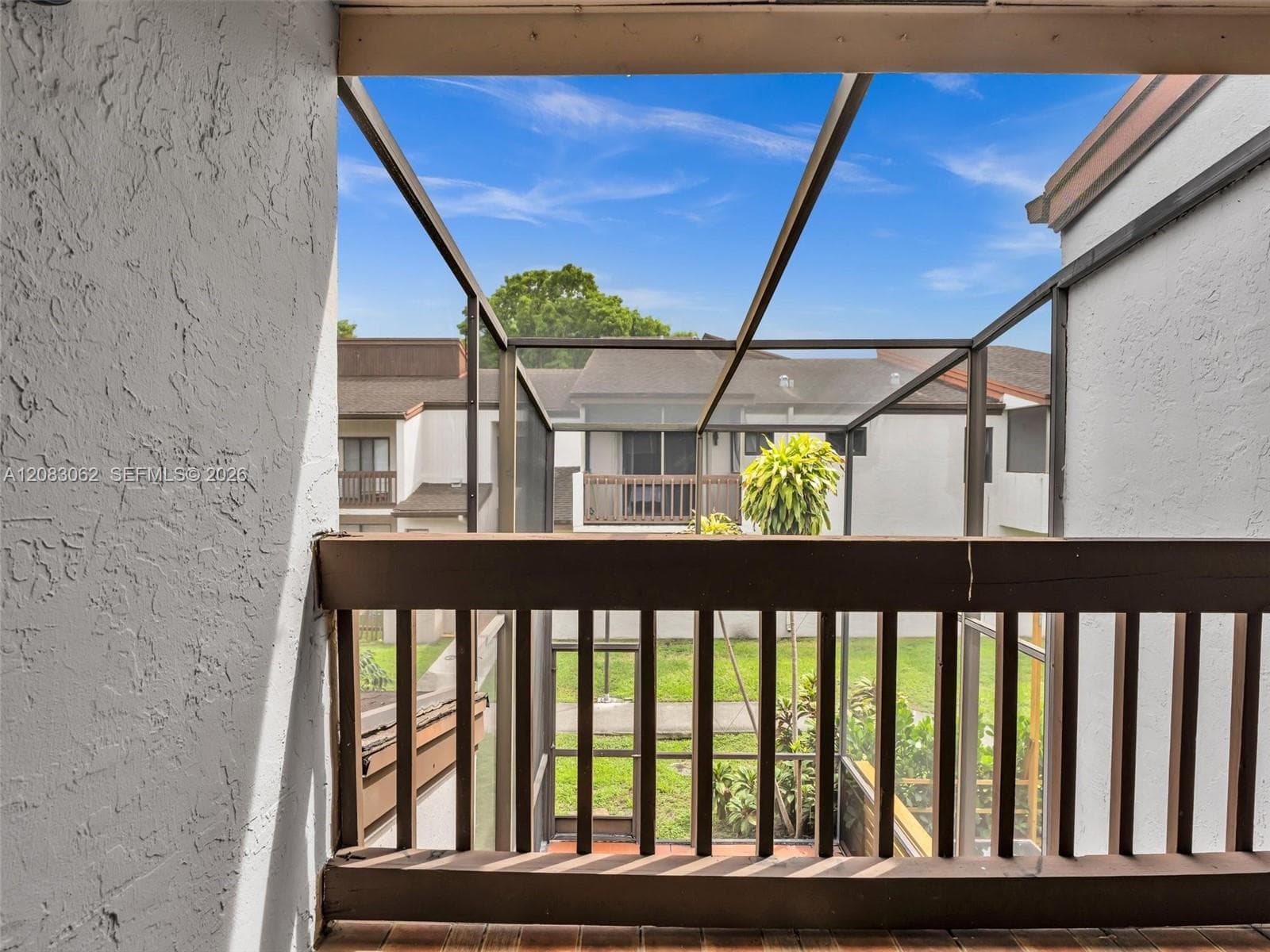 Primary Bedroom with full bathroom, balcony and walk in closet.