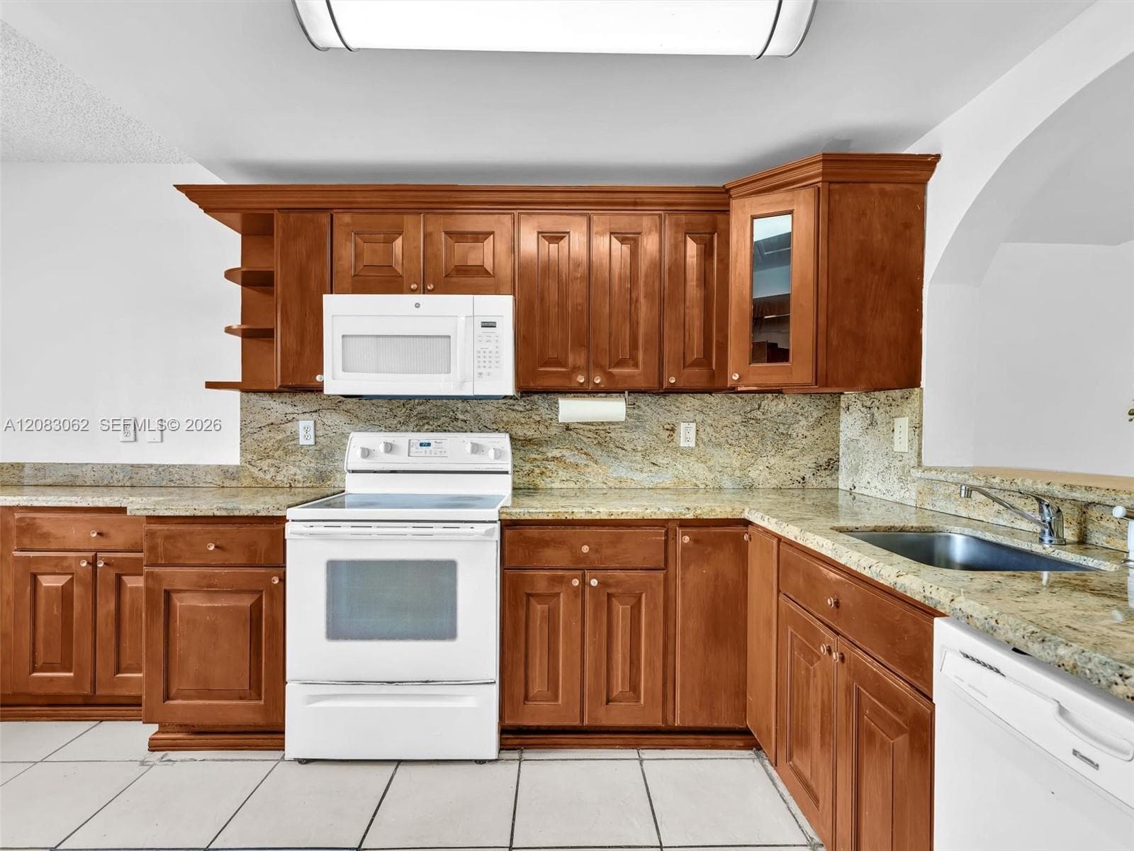 Ample Kitchen, Granite Counters, and huge window brings in natural light.