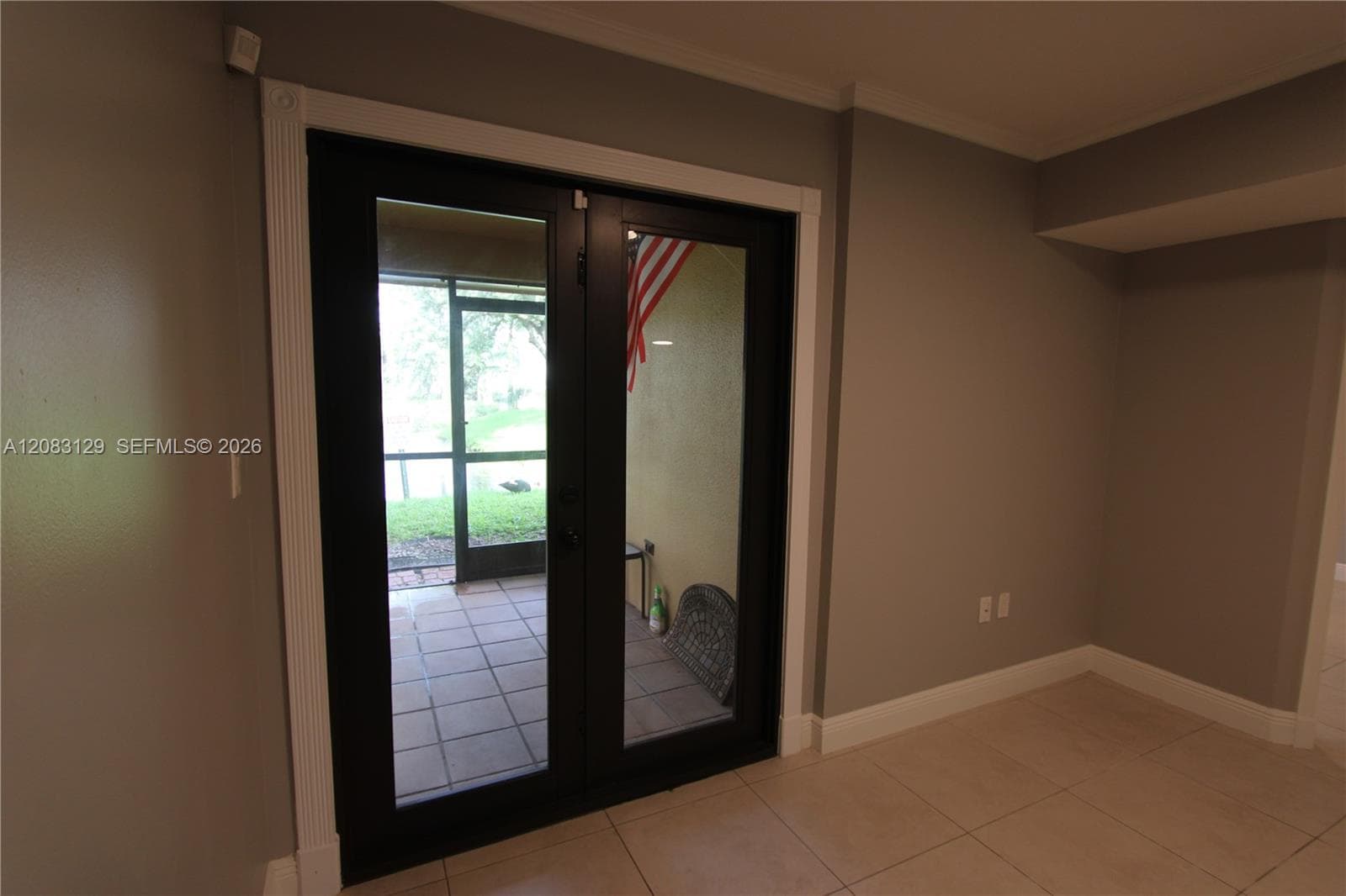 Impact door leading to screened patio