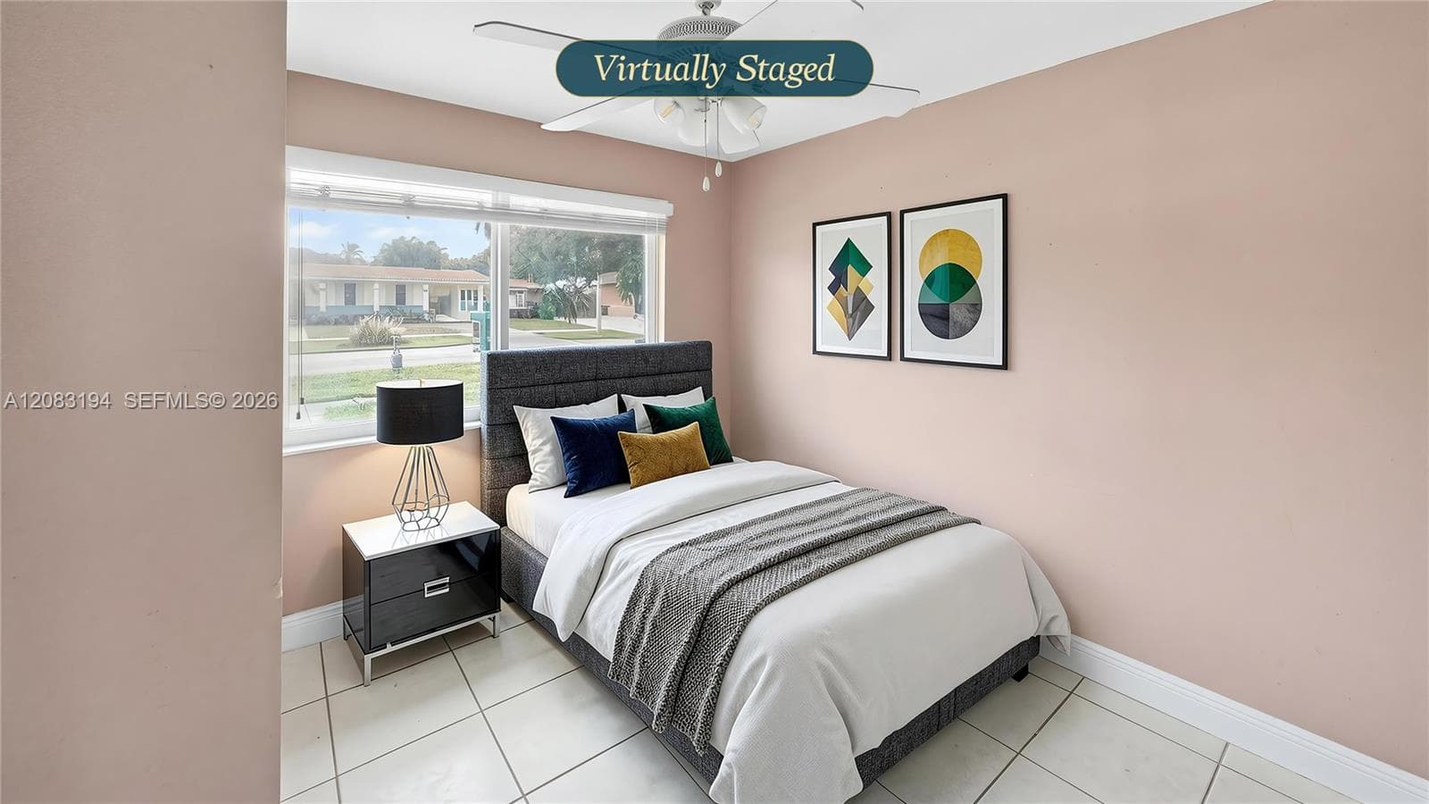 Room featuring large-format ceramic tile flooring, neutral wall tones, a ceiling-mounted light fixture with fan, and a horizontal window with blinds