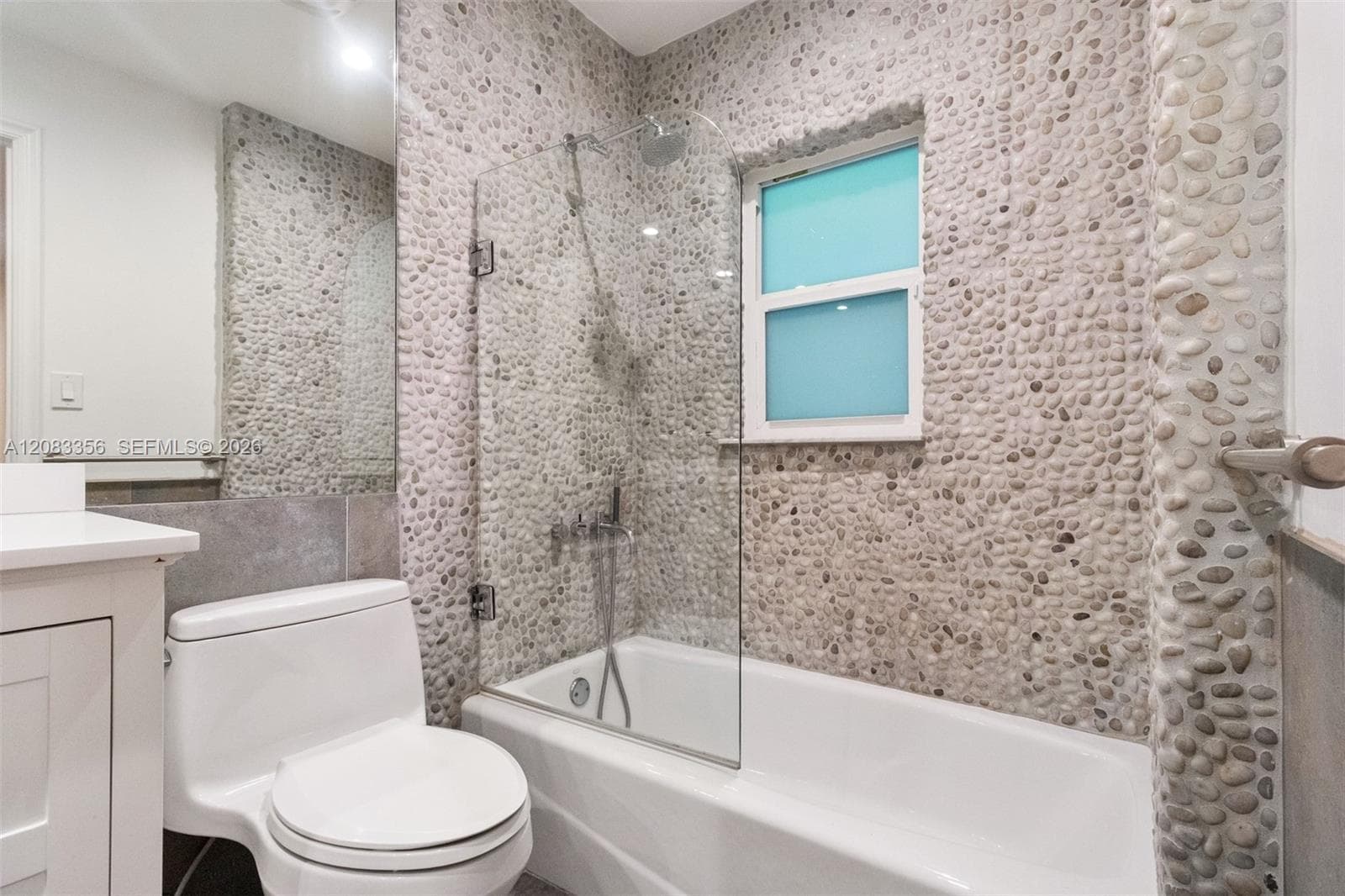 2nd Bedroom with Ensuite Bathroom and Natural River Rock Wall