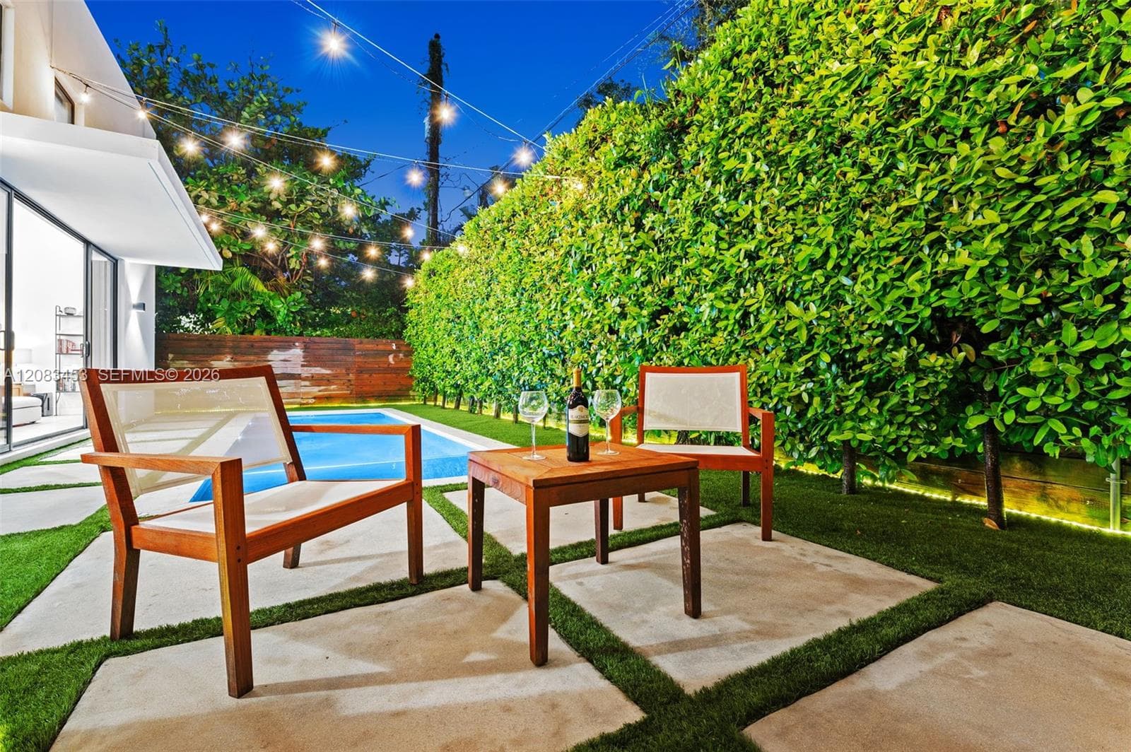 Twinkling lights lit up the low-maintenance backyard retreat.