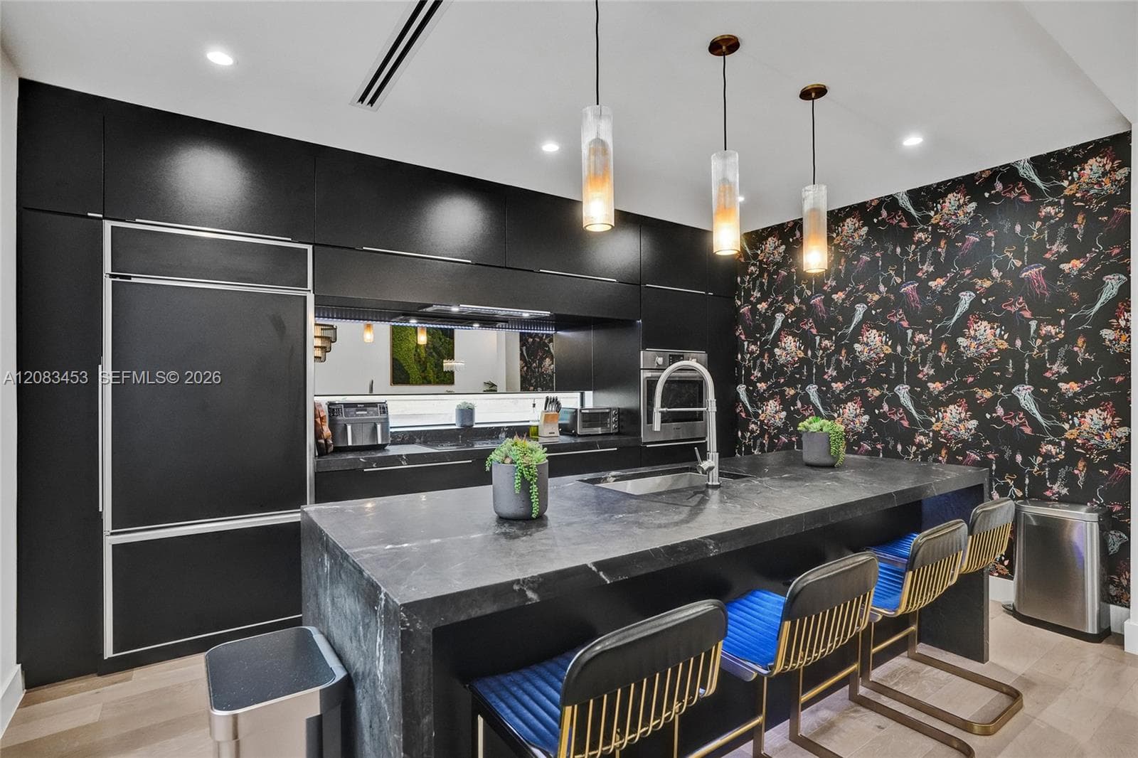 Chefs kitchen with huge center island and high-end appliances