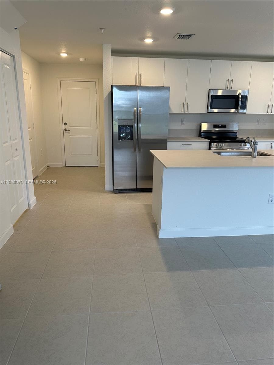 Kitchen and 2nd entrance view