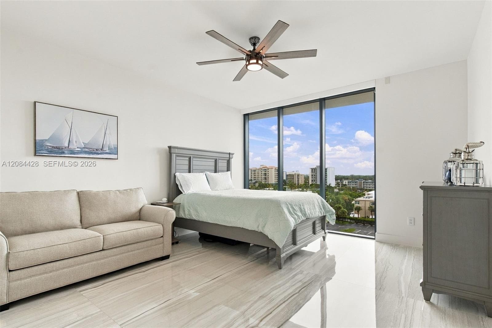 Spacious guest bedroom with a queen-size bed and full-size pullout sofa.