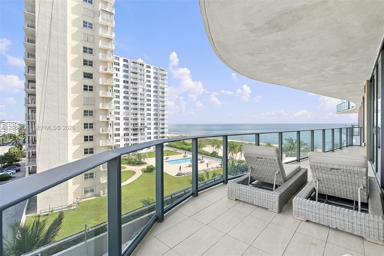 Private balcony with comfortable seating and beautiful panoramic views.