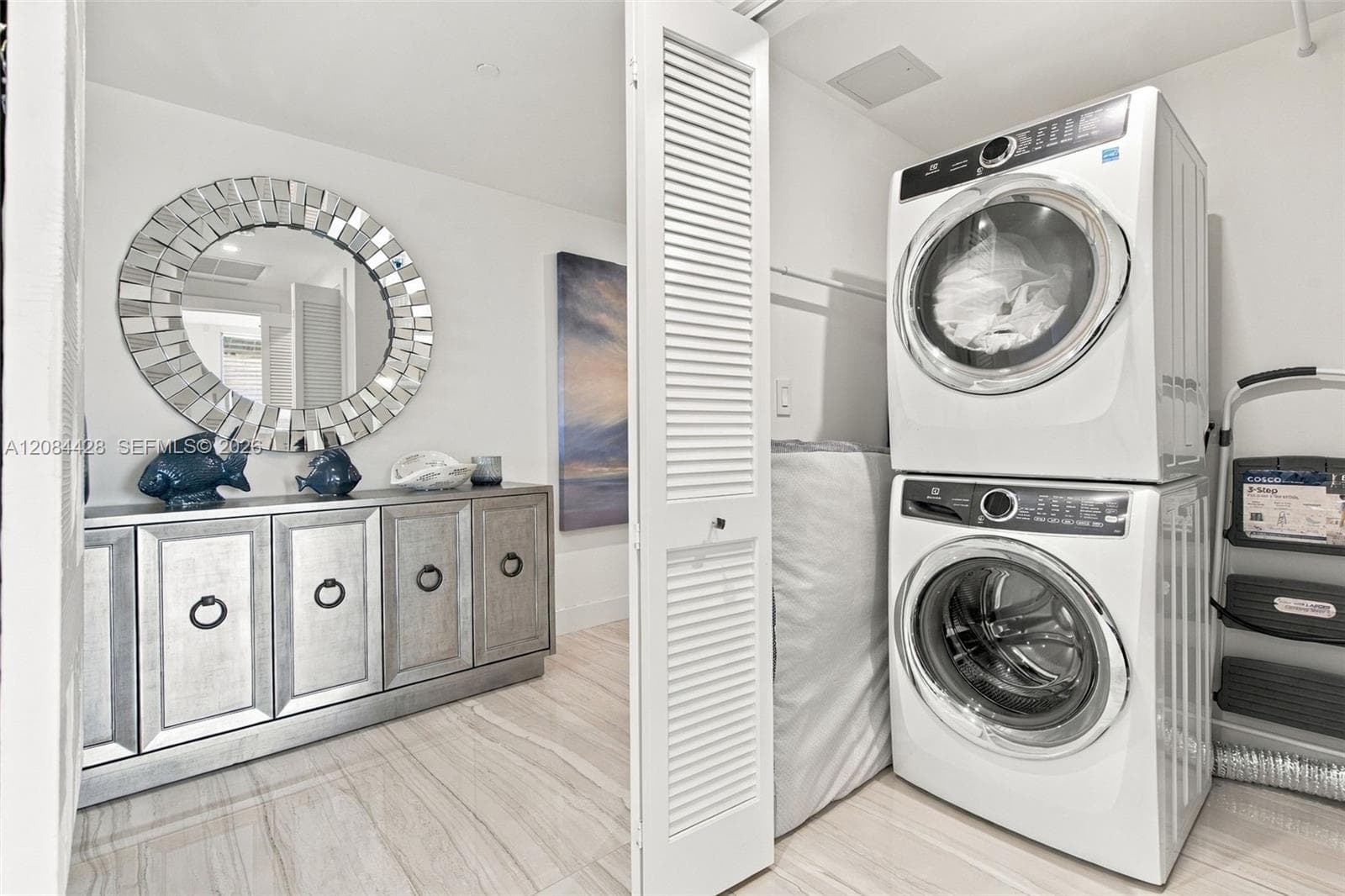 In-unit laundry room with full size washer and dryer.