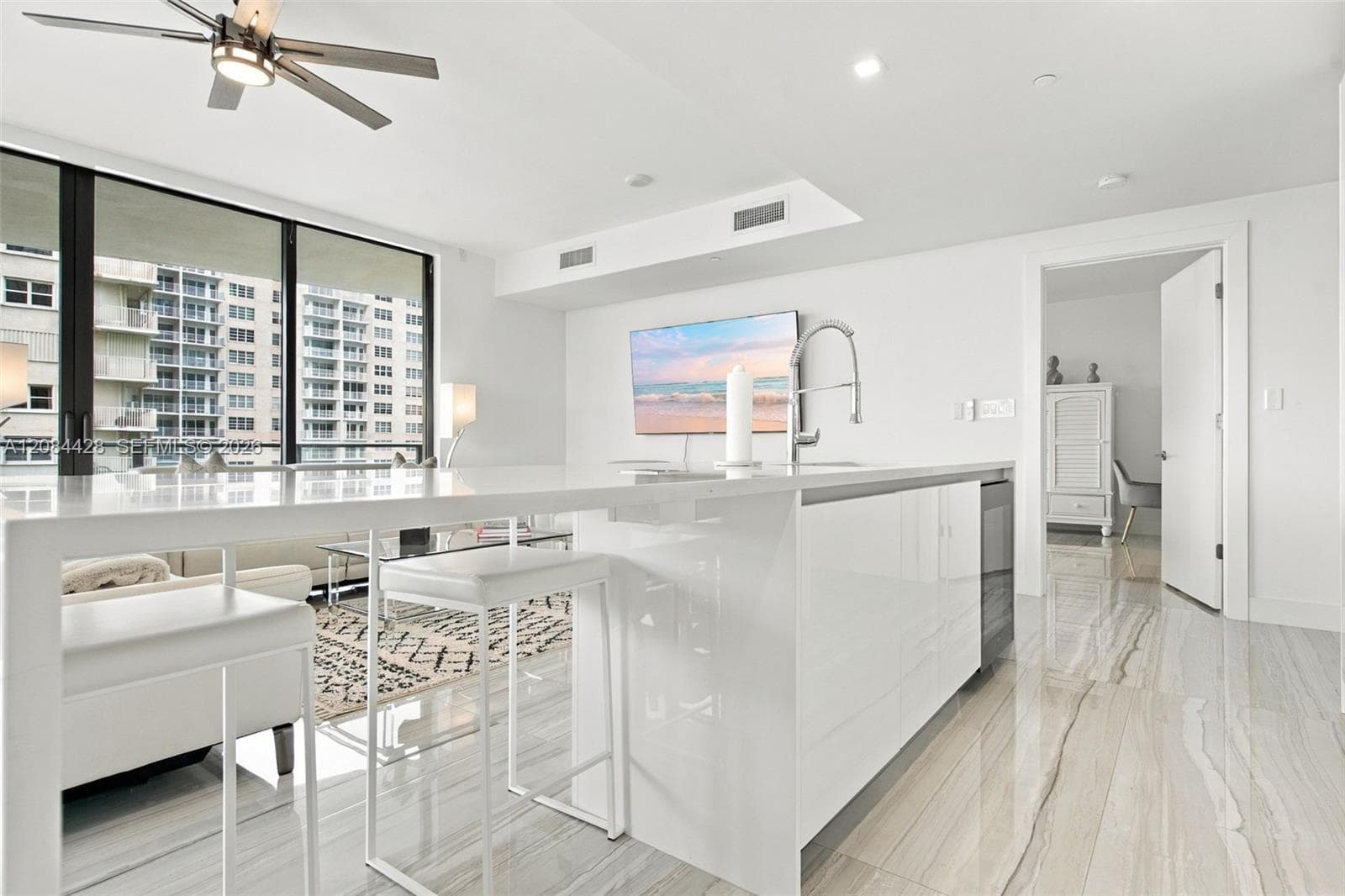 Oversized kitchen island with seating and generous preparation space.