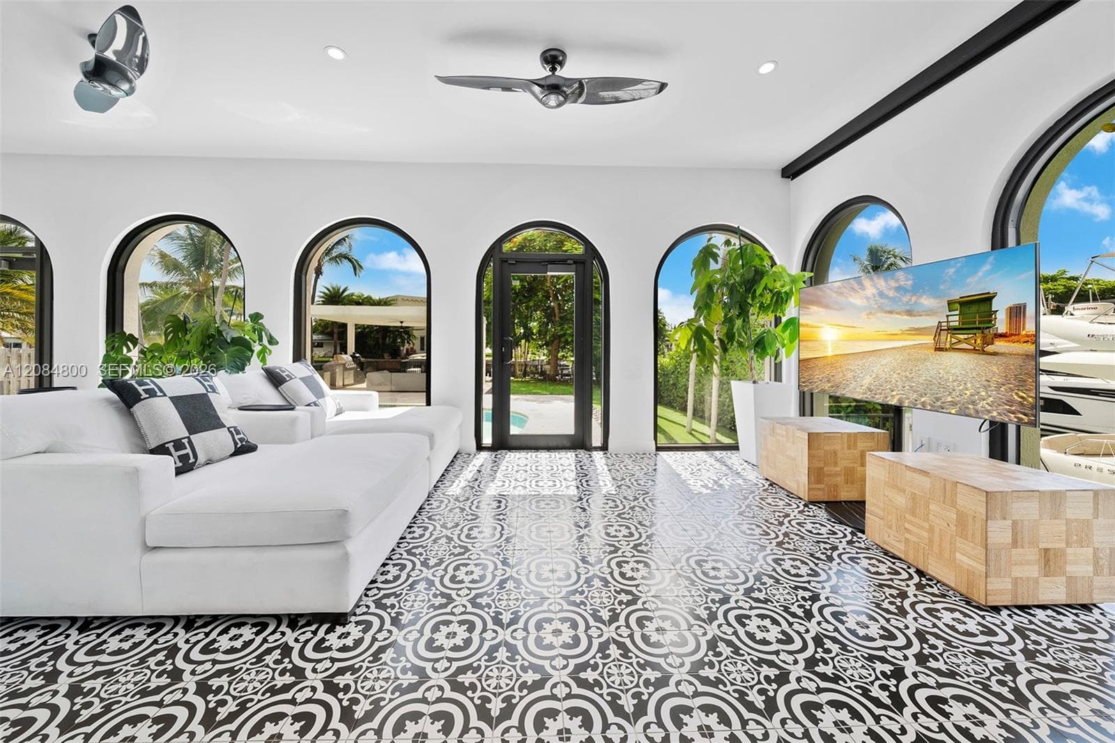 A glass-wrapped terrace room — indoor comfort, waterfront views all around