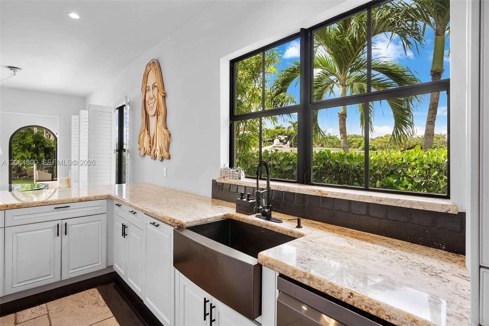 A window over the sink with canal views — washing up never looked this good.