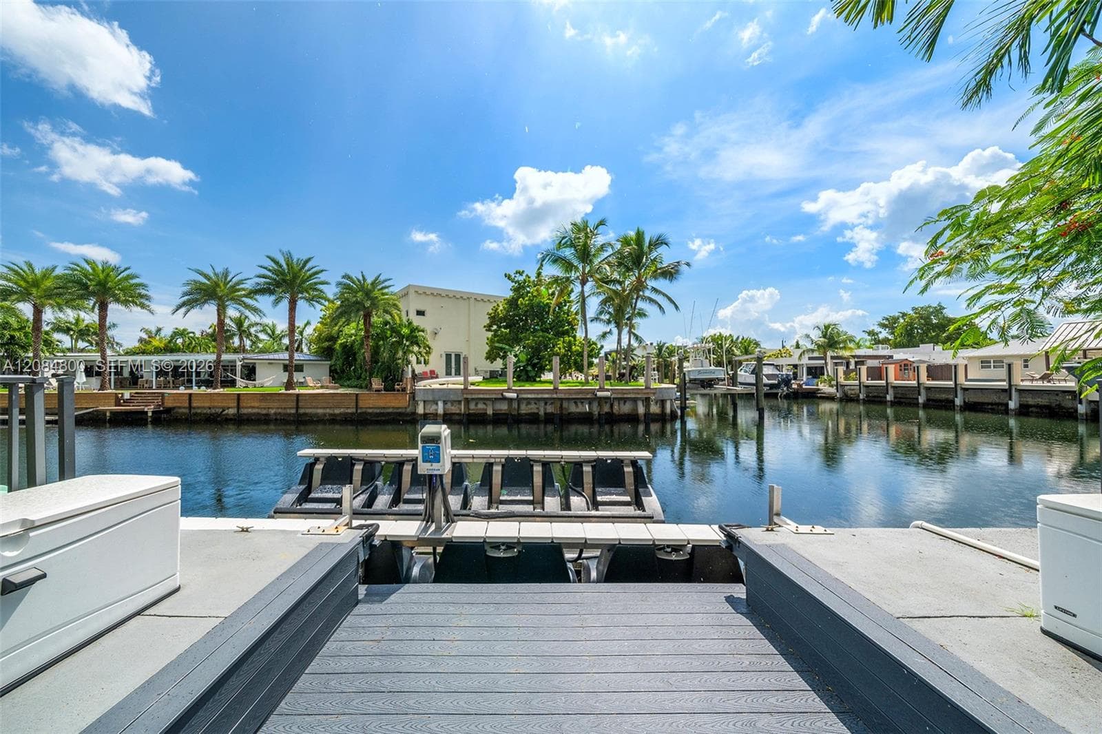 Boat lift & a dedicated Jet Ski dock completes the waterfront setup.