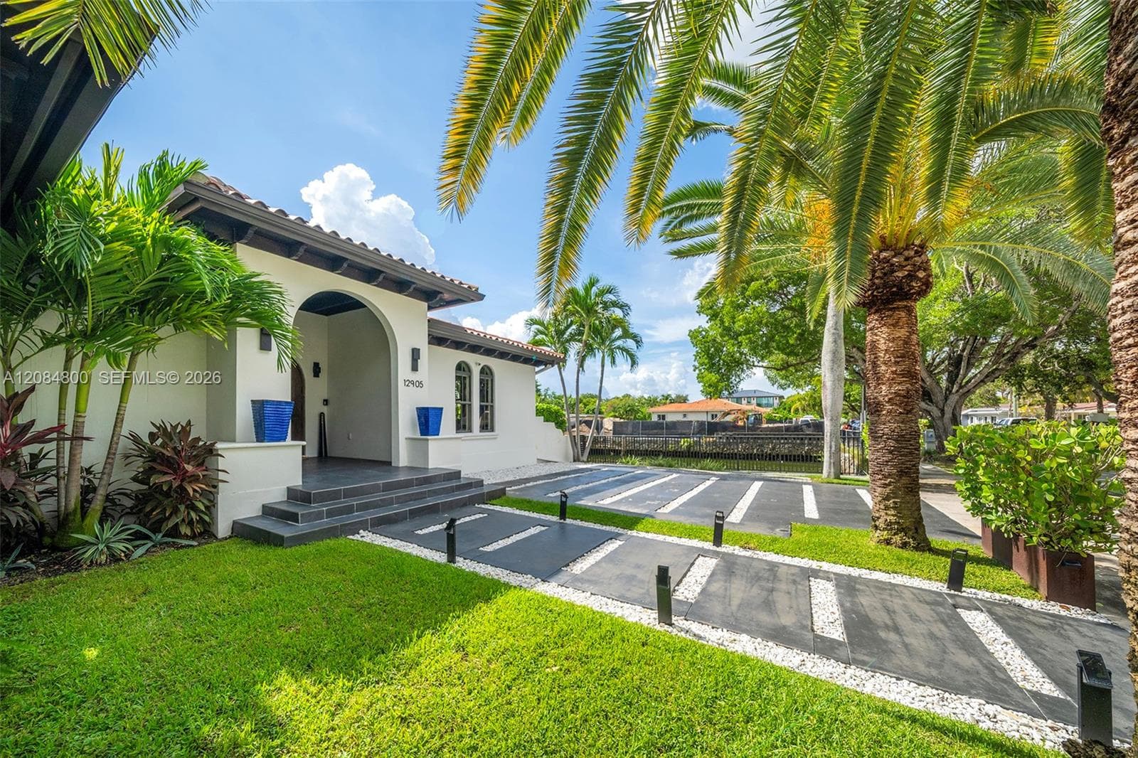 Mediterranean waterfront, fully renovated, elevated 11 feet — turnkey and ready.