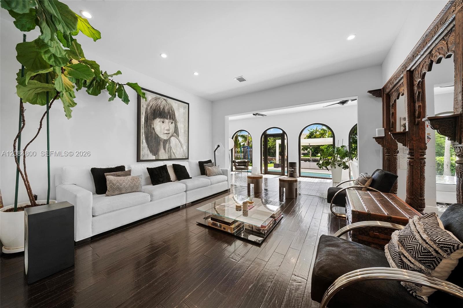 Expansive living area with soaring ceilings and light pouring in from every side