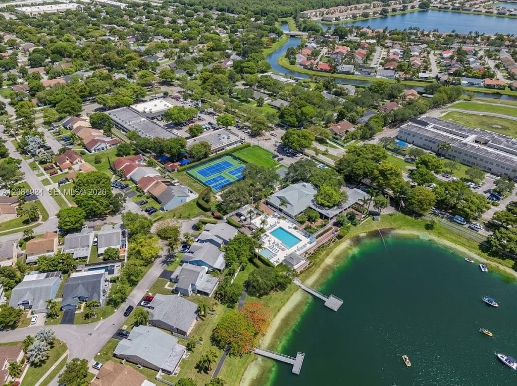 Panoramic aerial view of the surrounding neighborhood, lakes, and nearby amenities.