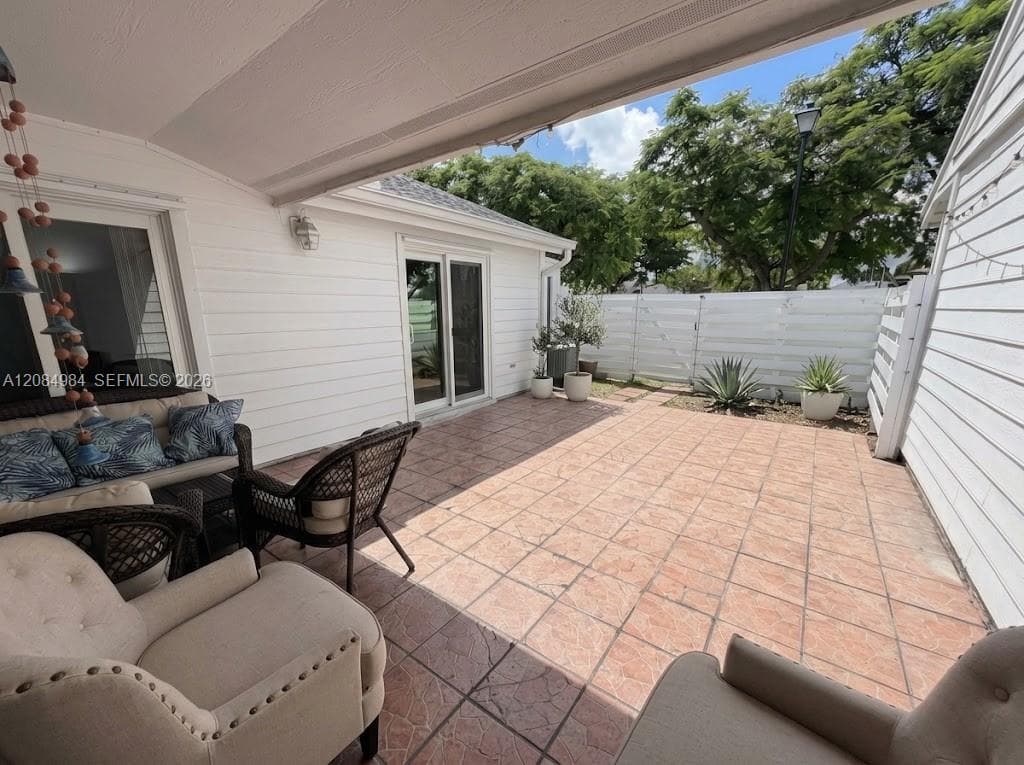 Private paved patio area ideal for outdoor seating, dining, and relaxation.