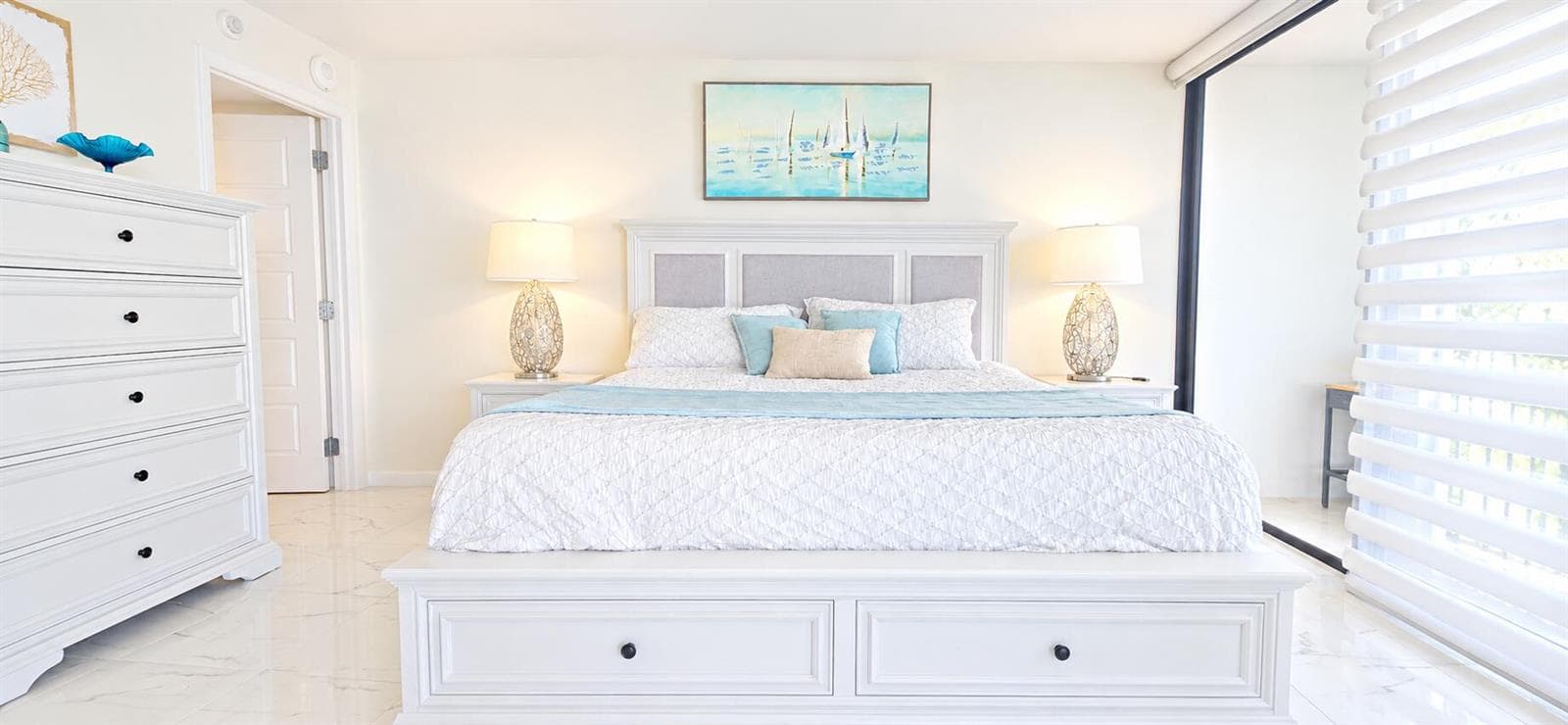 Bright Coastal Bedroom with Glowing Lamp