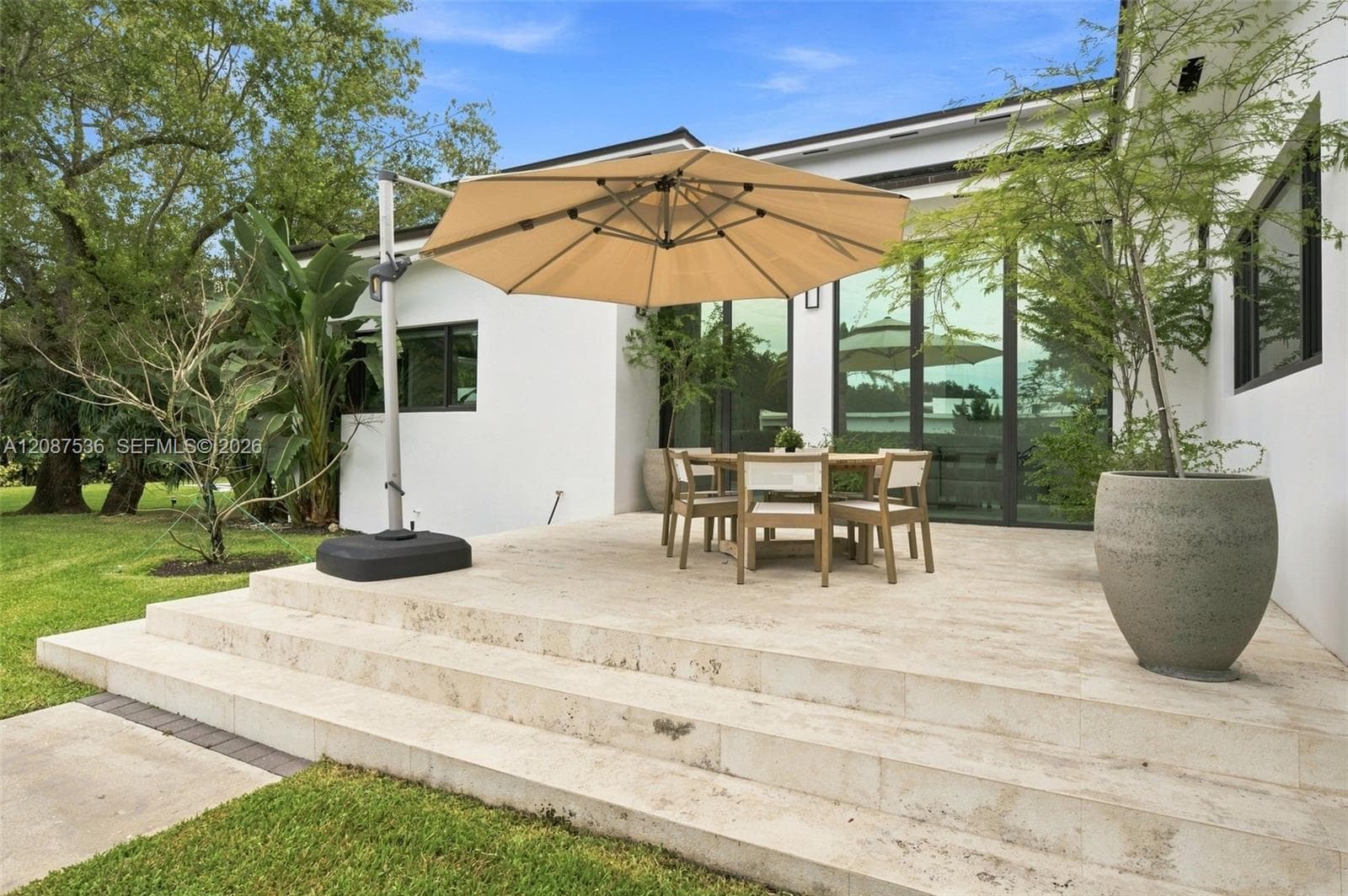 Side terrace facing pickleball court