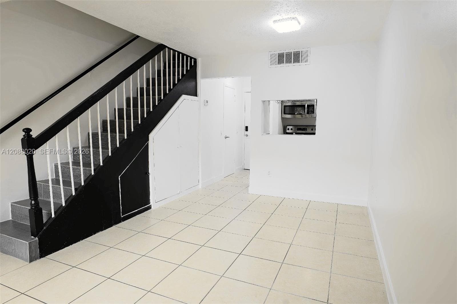 1/2 Bath in hallway on left.