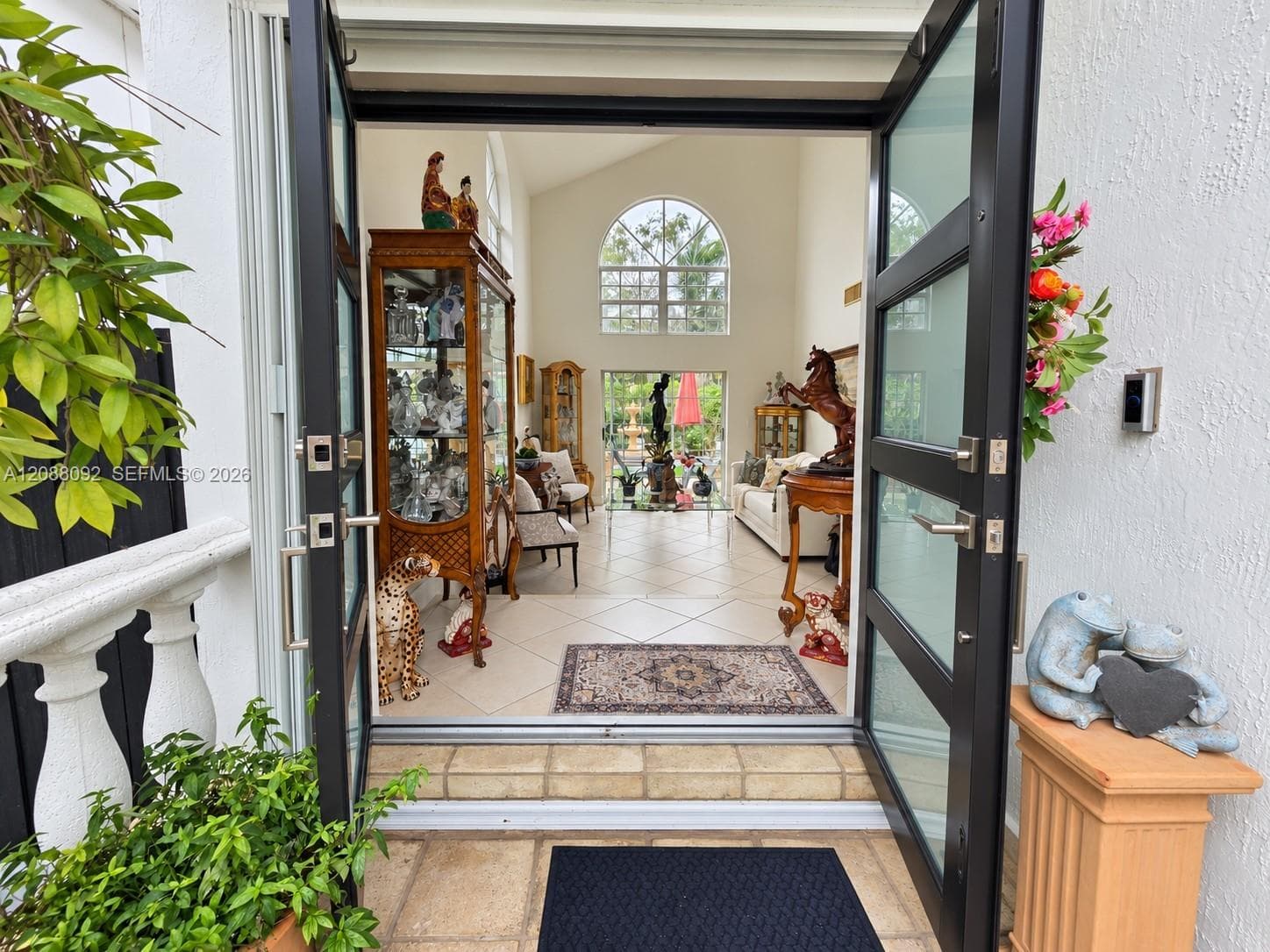 Double impact doors into foyer followed by Living Room