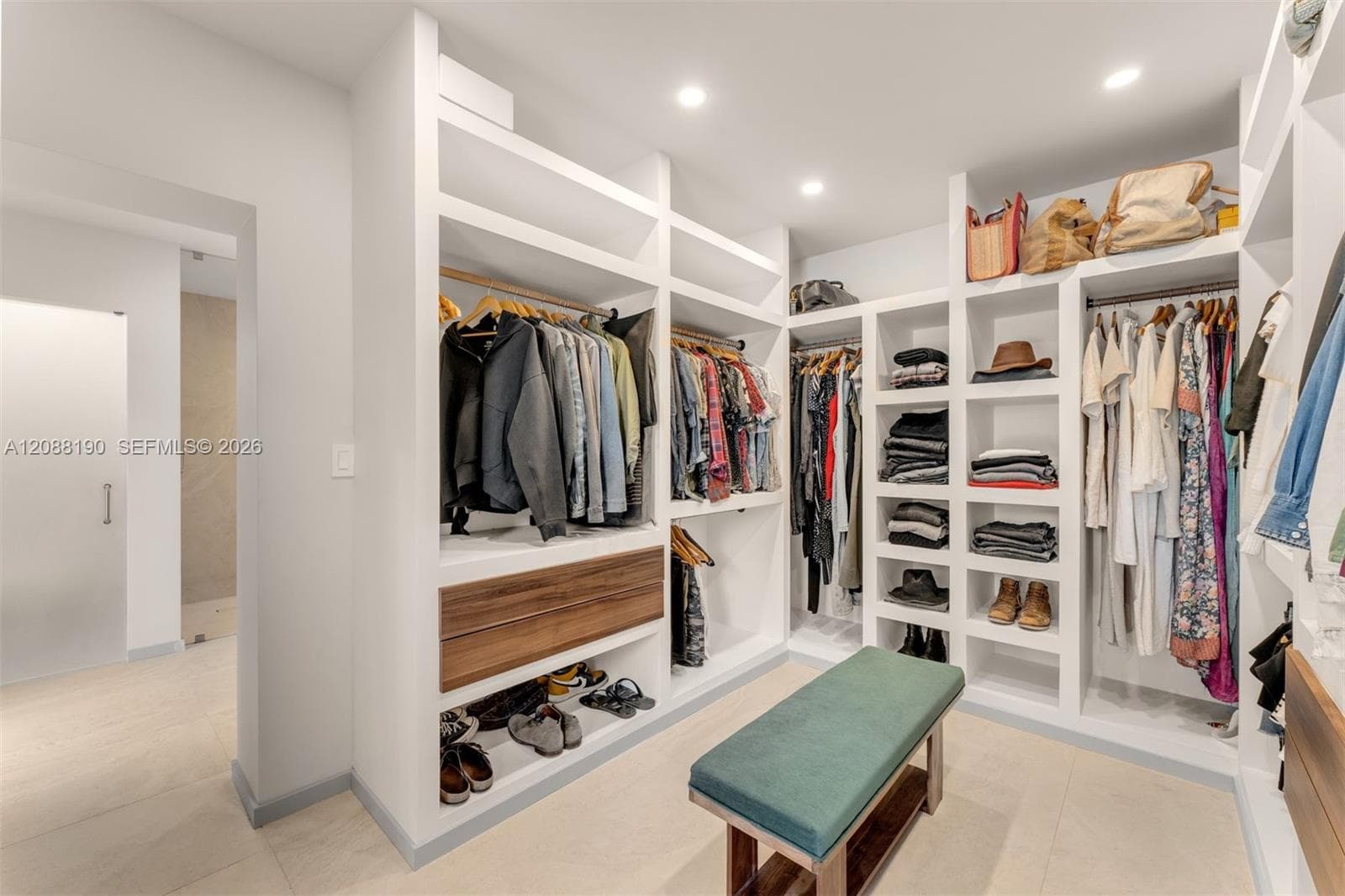 Bedroom wing common area with closets for studio or library