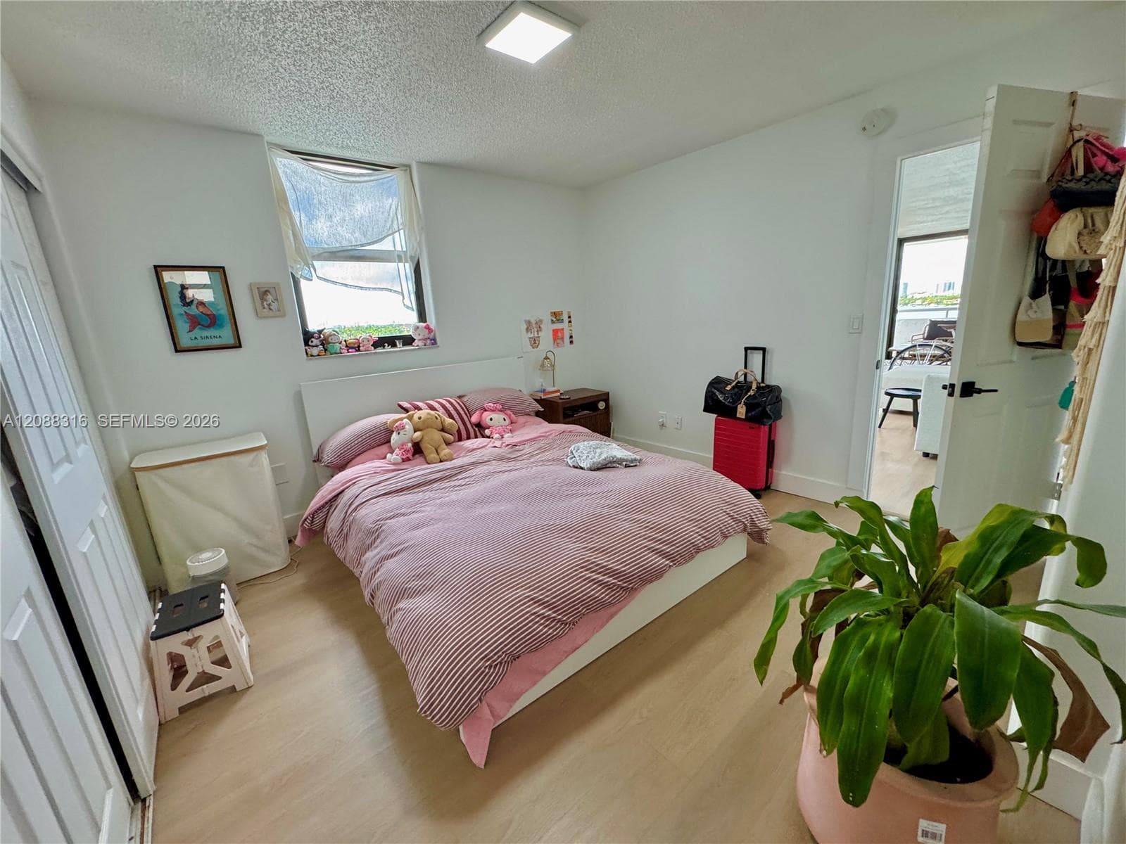 Virtually Staged spacious primary bedroom with ensuite bathroom and lots of walk-in closet space.