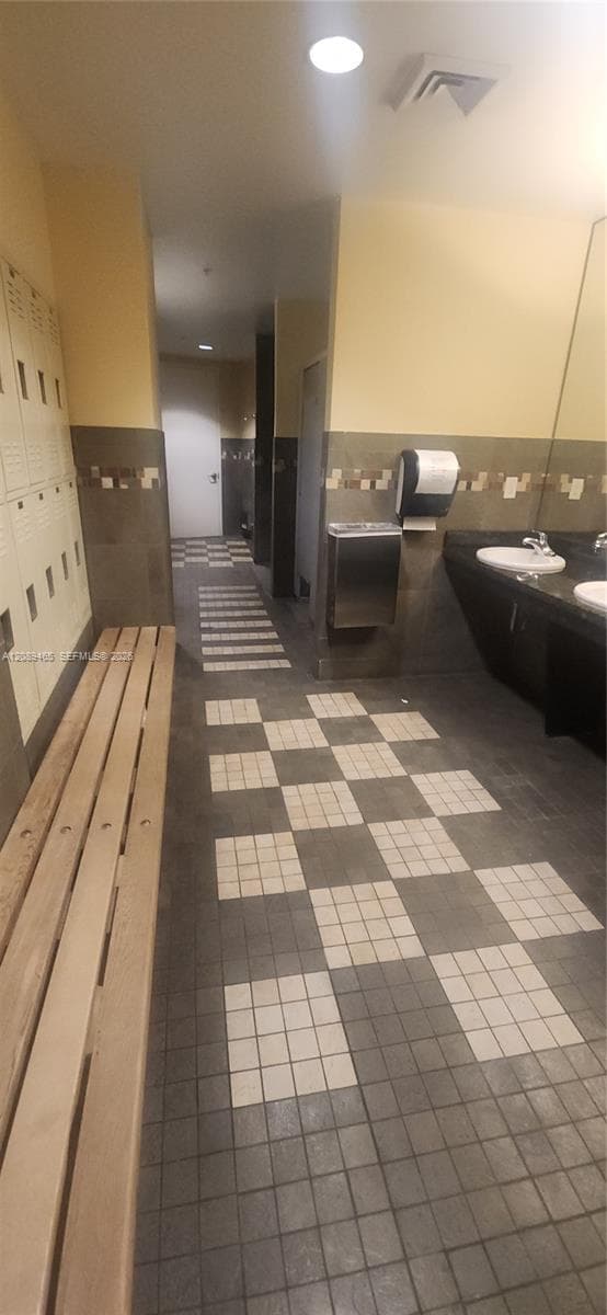 lockers, showers, bathrooms etc. leading to the sauna and steam rooms