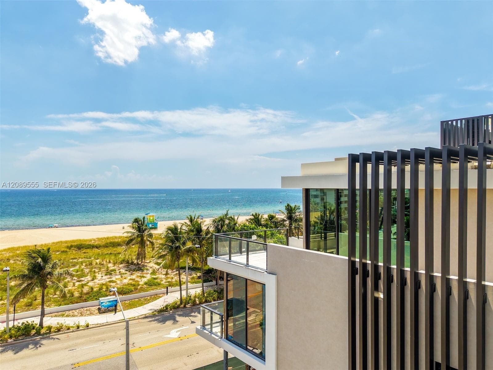 Louvered facade with the beach beyond.