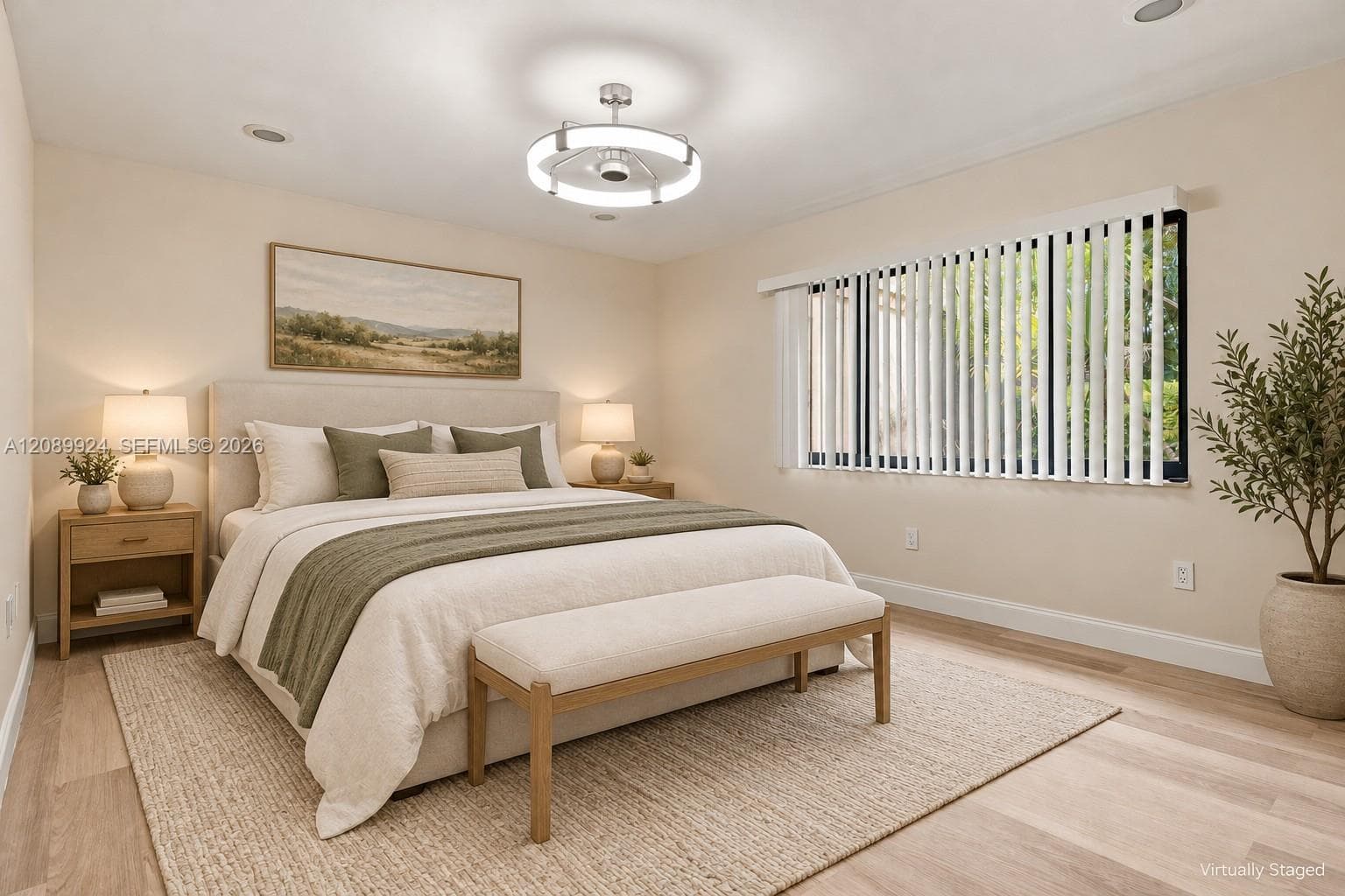 Neutral-toned room featuring wood-finish flooring, recessed lighting, a modern circular ceiling fan with integrated lighting, and vertical window blinds