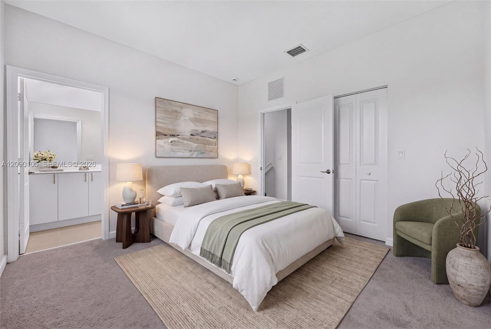 Neutral-toned bedroom featuring carpeted flooring, high ceilings, and bi-fold closet doors