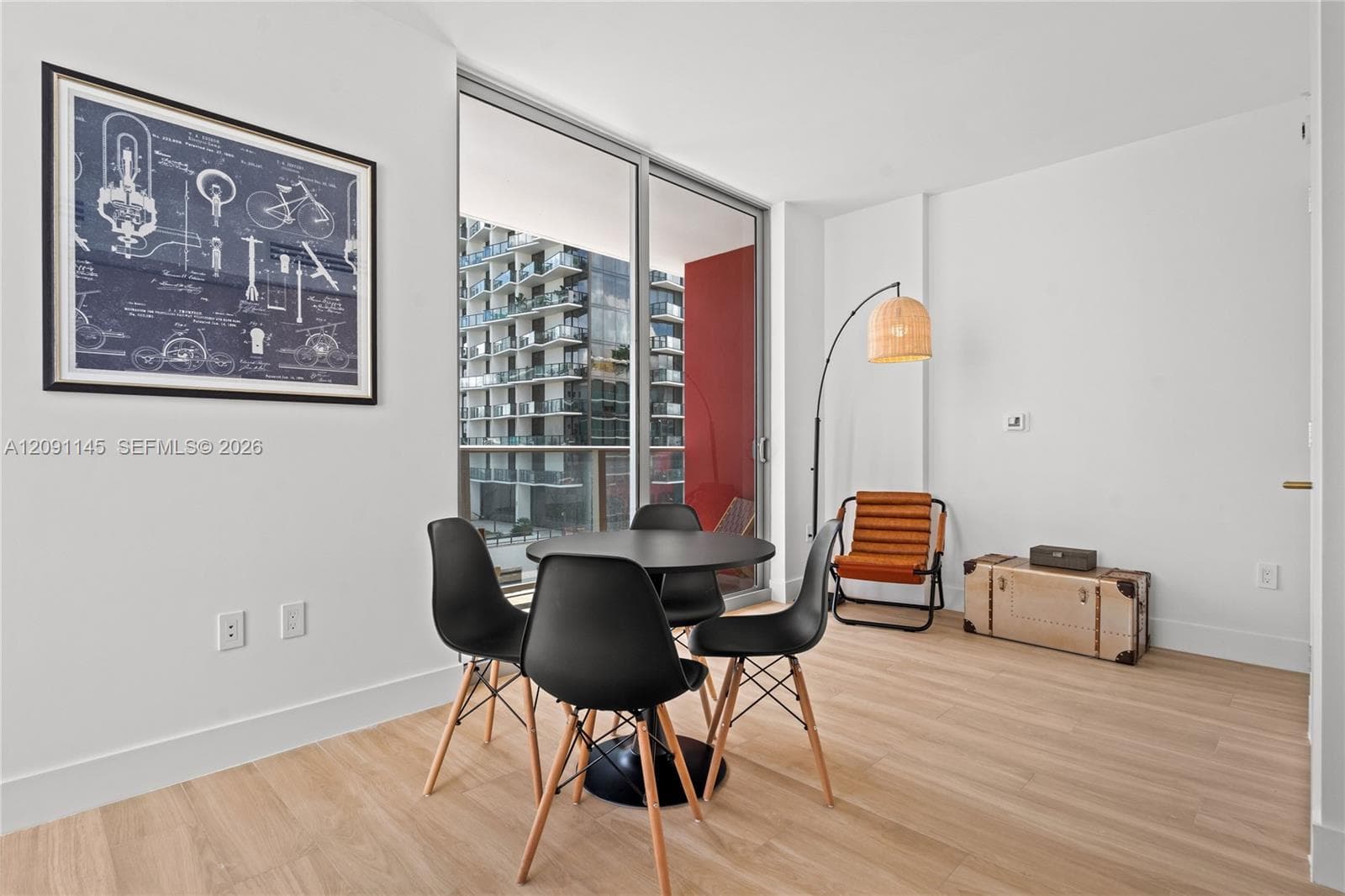 Wood-finish flooring throughout, with clean white walls and a white ceiling