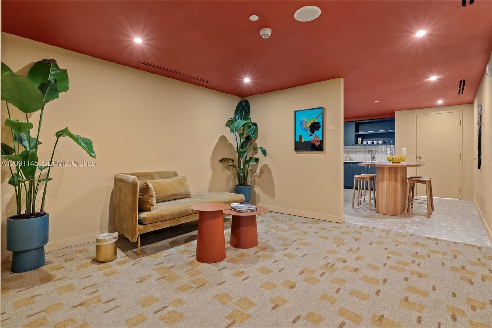 Recessed lighting, patterned carpeting, integrated kitchen area with built-in cabinetry, and tile flooring