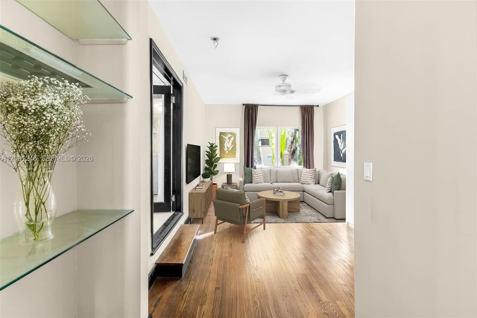 passageway to living area with built in shelving