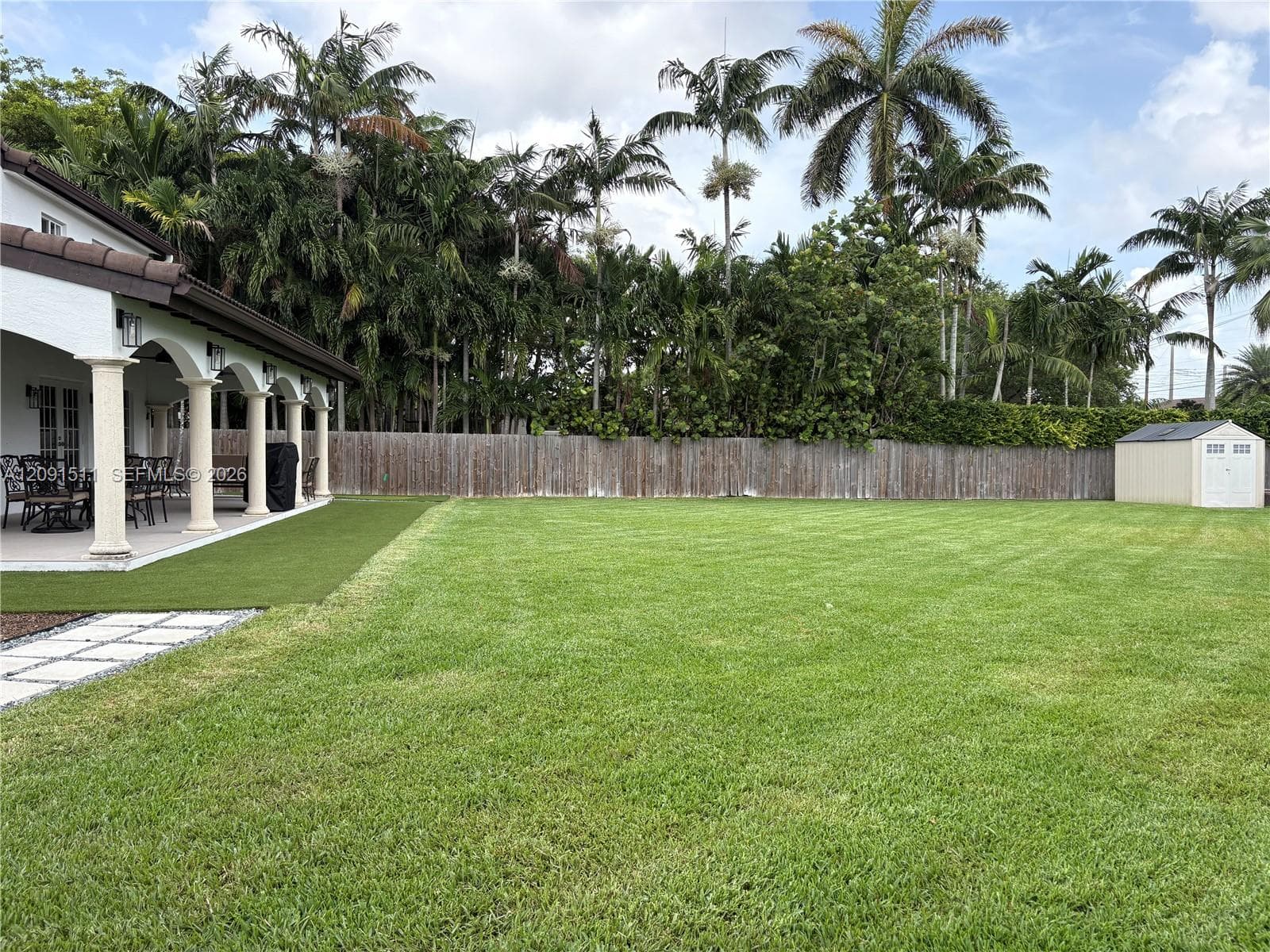 See the large shed in the rear corner of the yard