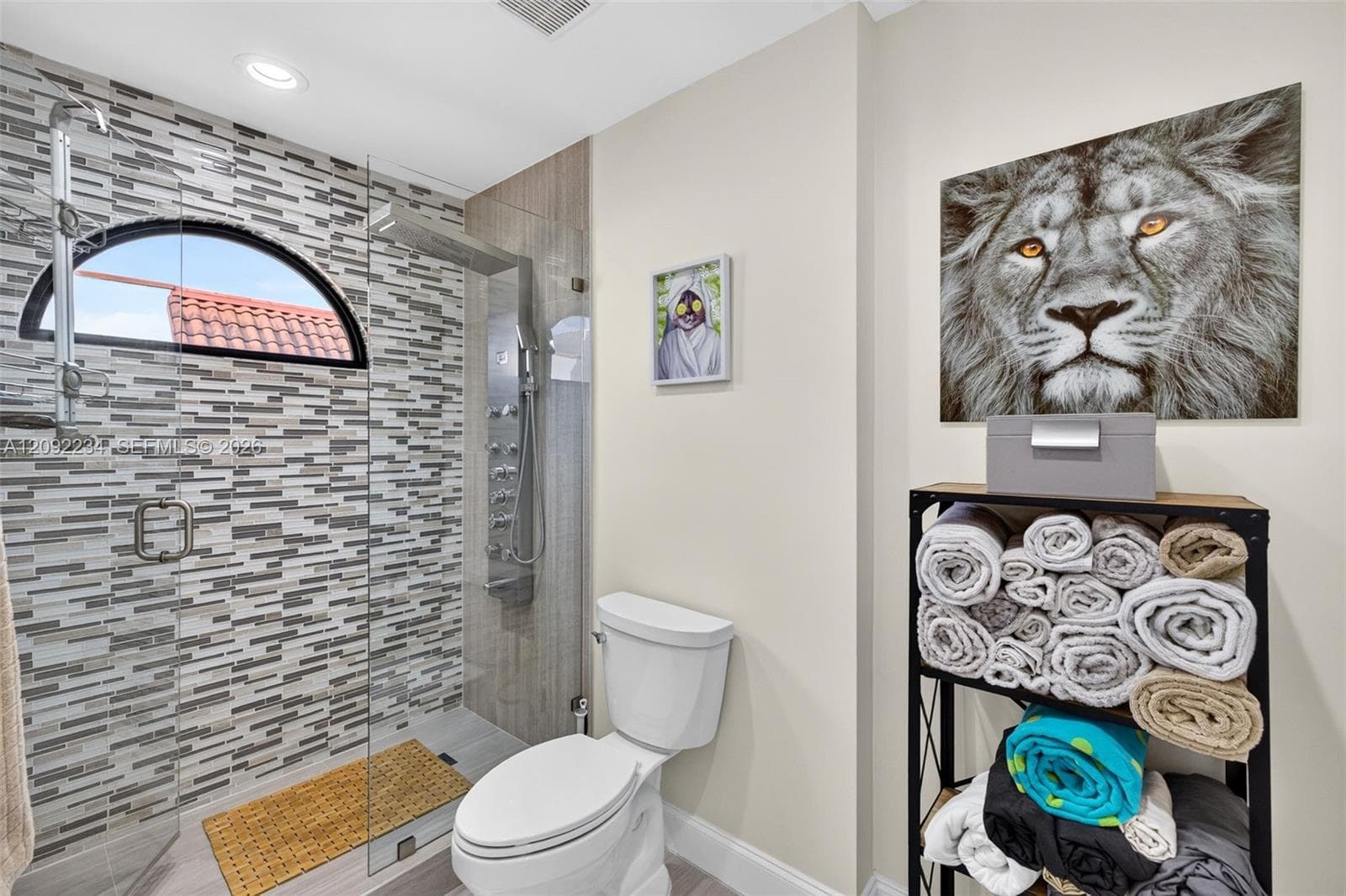 Gorgeous Tile Work the Master Bathroom Illuminated by the Skylight Above the Master Bathroom