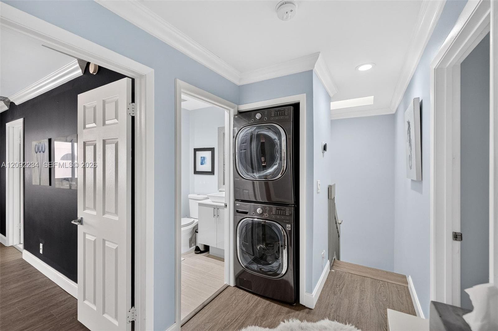 Stacked High-End Washer and Dryer Were Installed Upstairs Next to the Bedrooms for Convenience