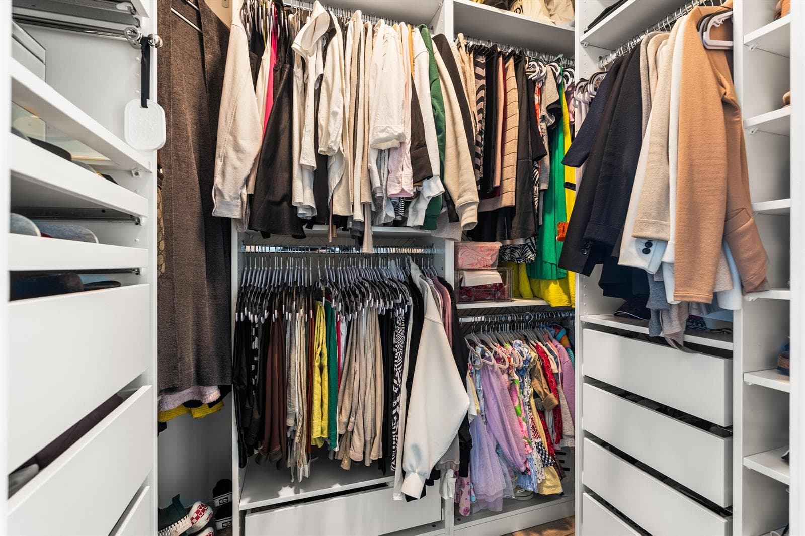 Walk In Closet with Custom Cabinetry