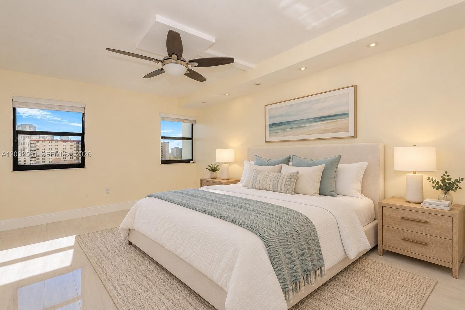 Recessed lighting, ceiling fan with integrated light fixture, and large-format tile flooring