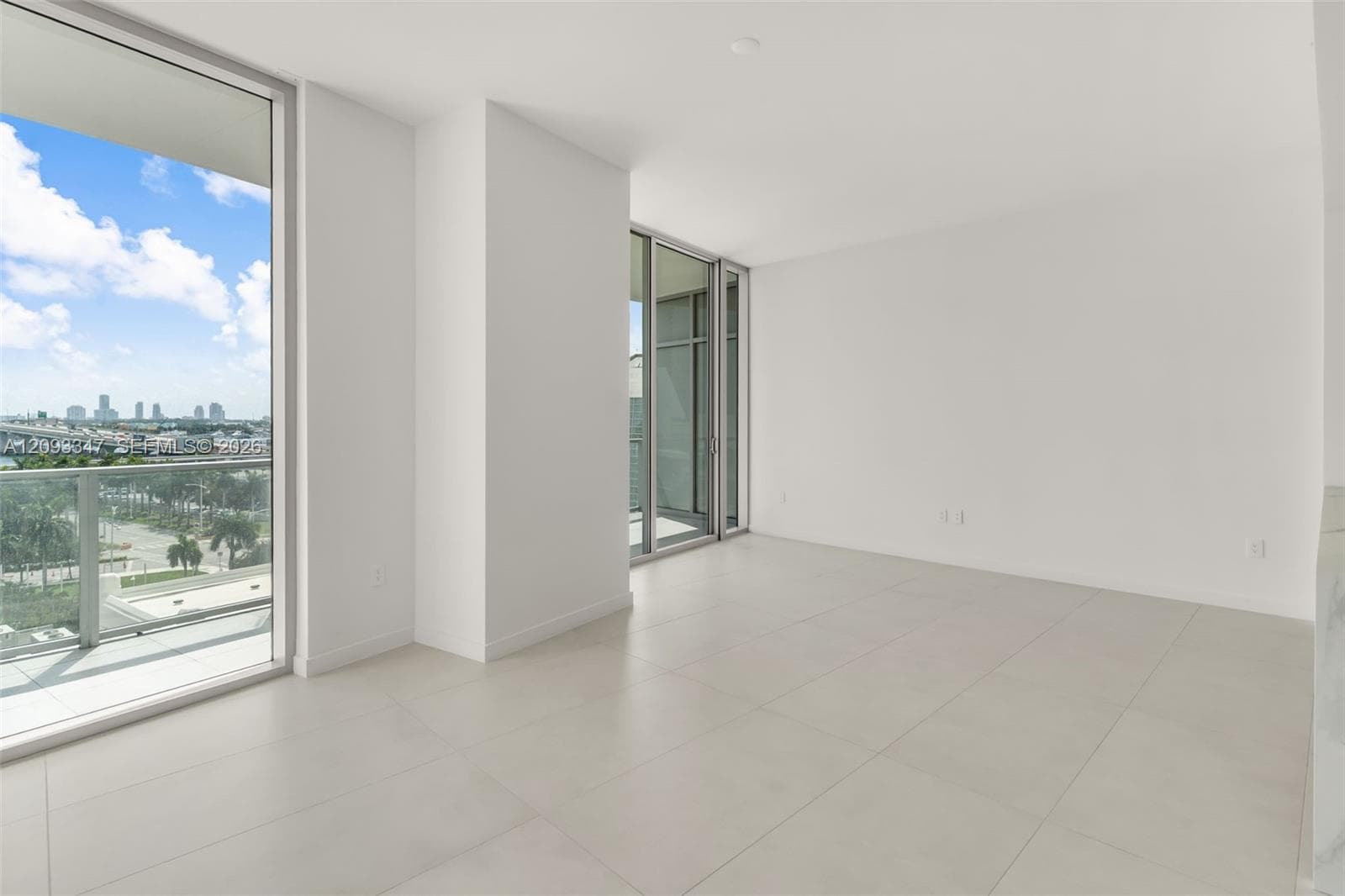 Living area measuring 22 by 18 feet with continuous glass to the terrace