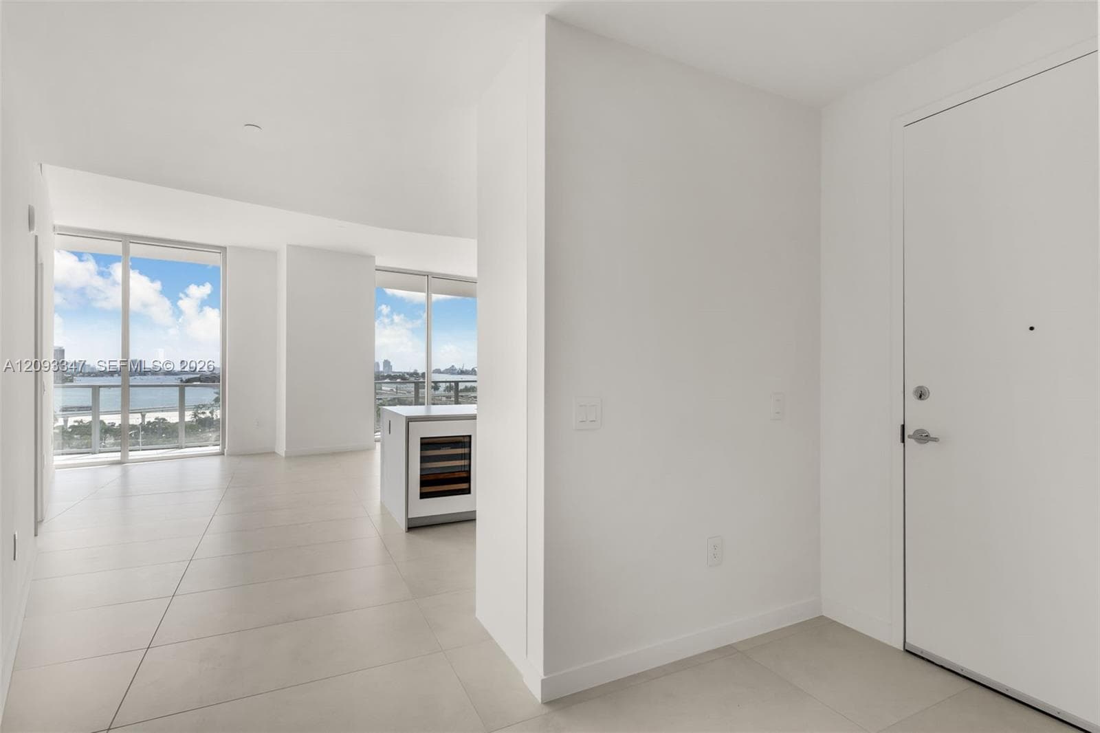 Entry hall opening directly into the living area with Biscayne Bay views