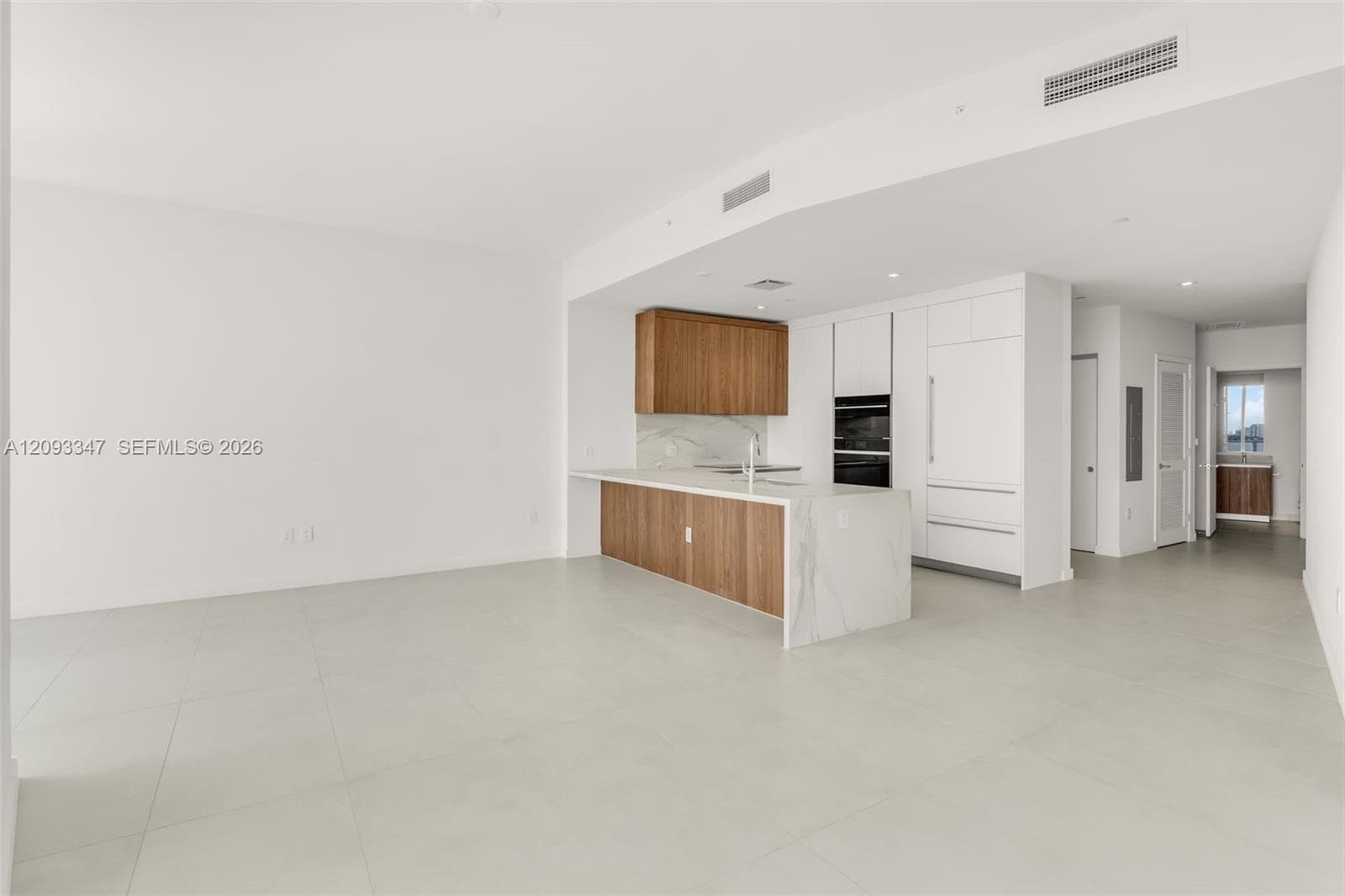 Great room spanning 22 feet across the largest one bedroom plan at Casa Bella
