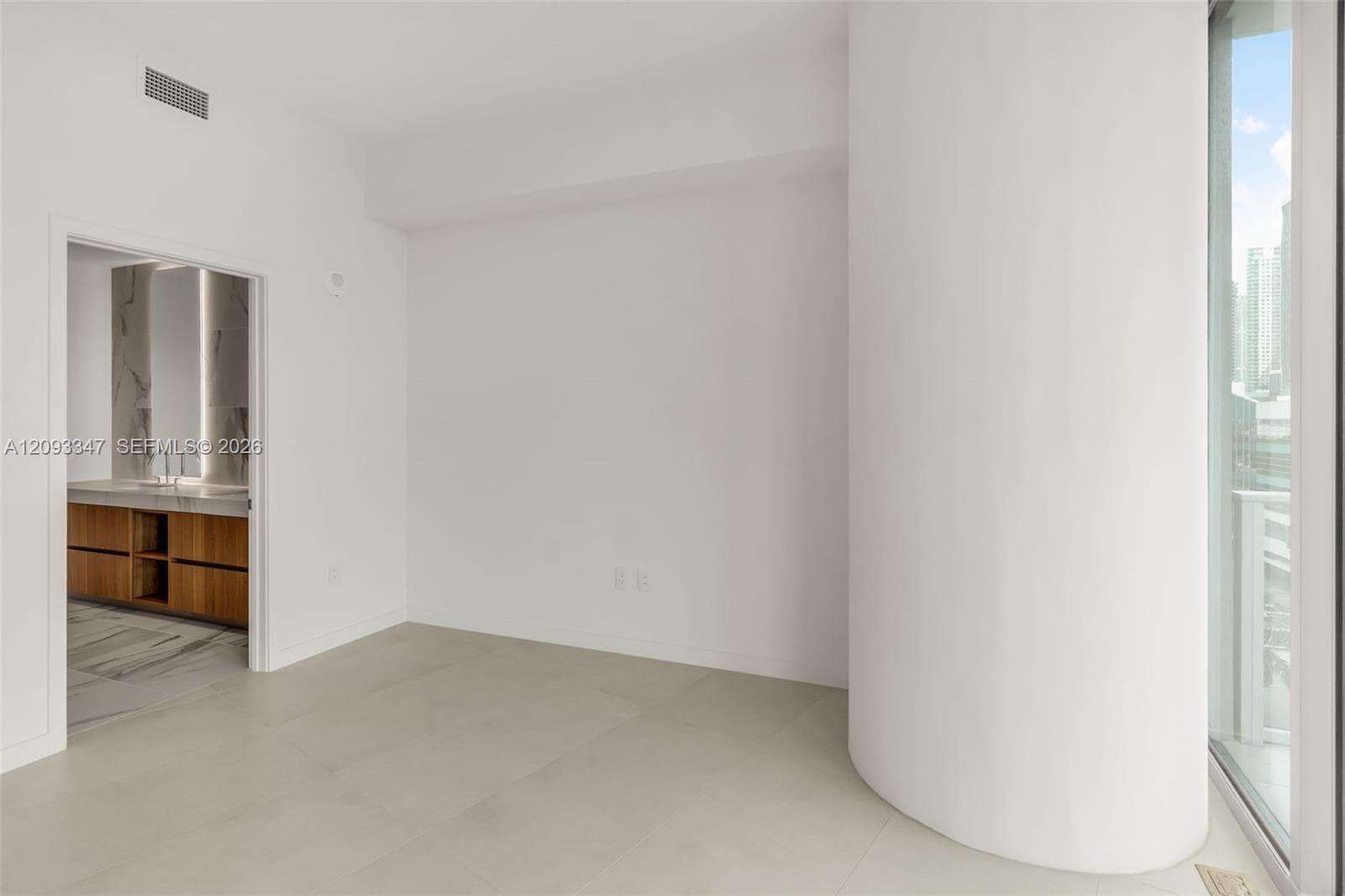 Primary bedroom with en suite bath and floor to ceiling windows