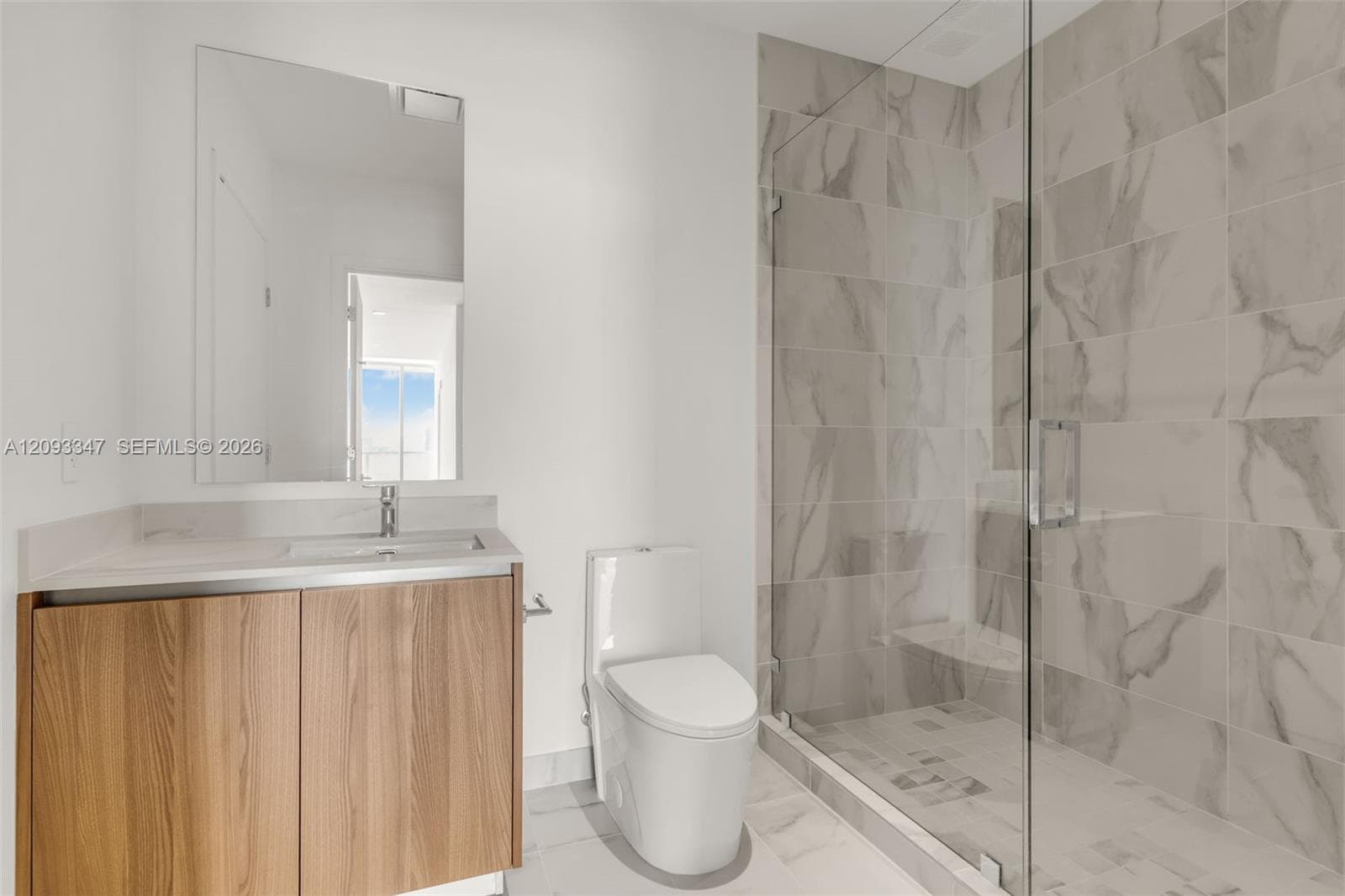 Second full bath with walk in shower and white oak vanity
