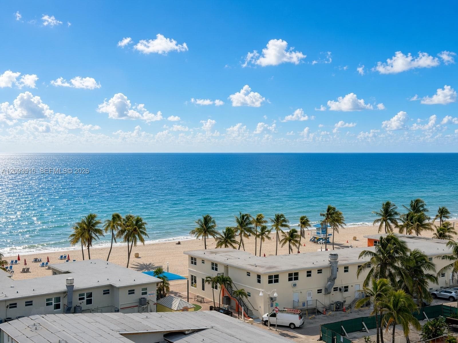 Direct waterfront location featuring expansive ocean scenery and palm-lined sandy coastline
