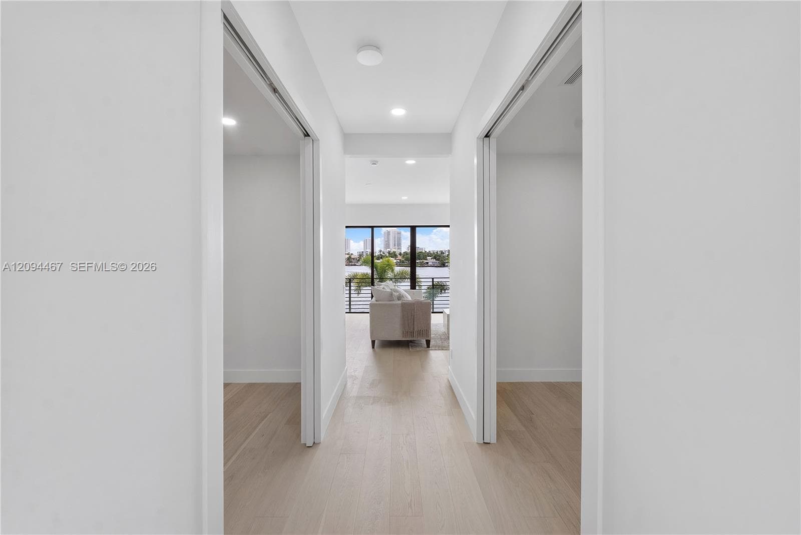 Second floor hallway and his & her closets on left and right